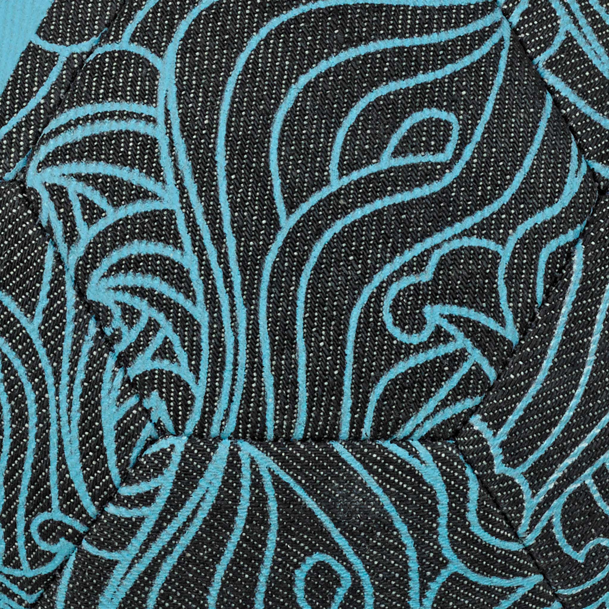 Closeup of FB Street v24 football fabric with navy blue and turquoise swirling pattern.
