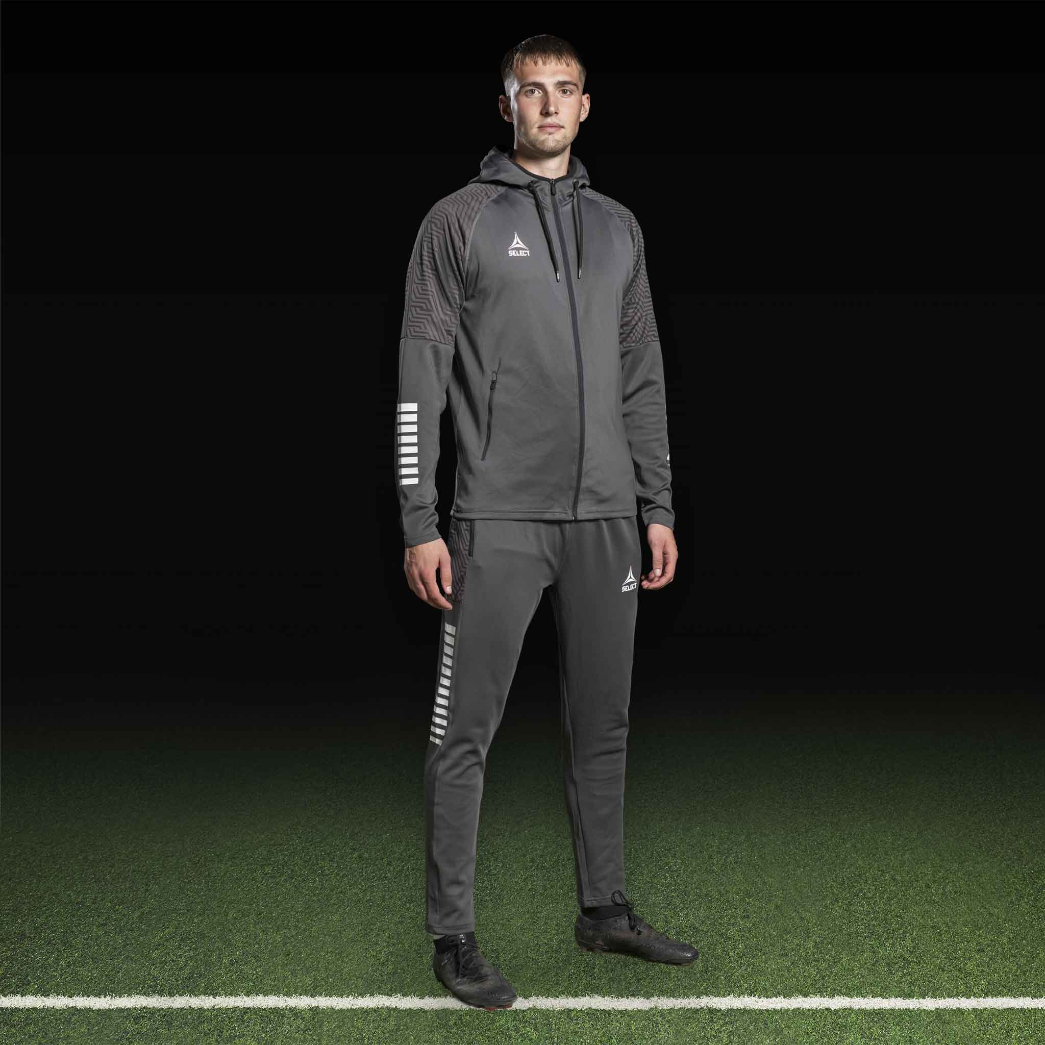 Male football player in grey and white Zip hoodie Monaco v24, Match & Training wear, front view.