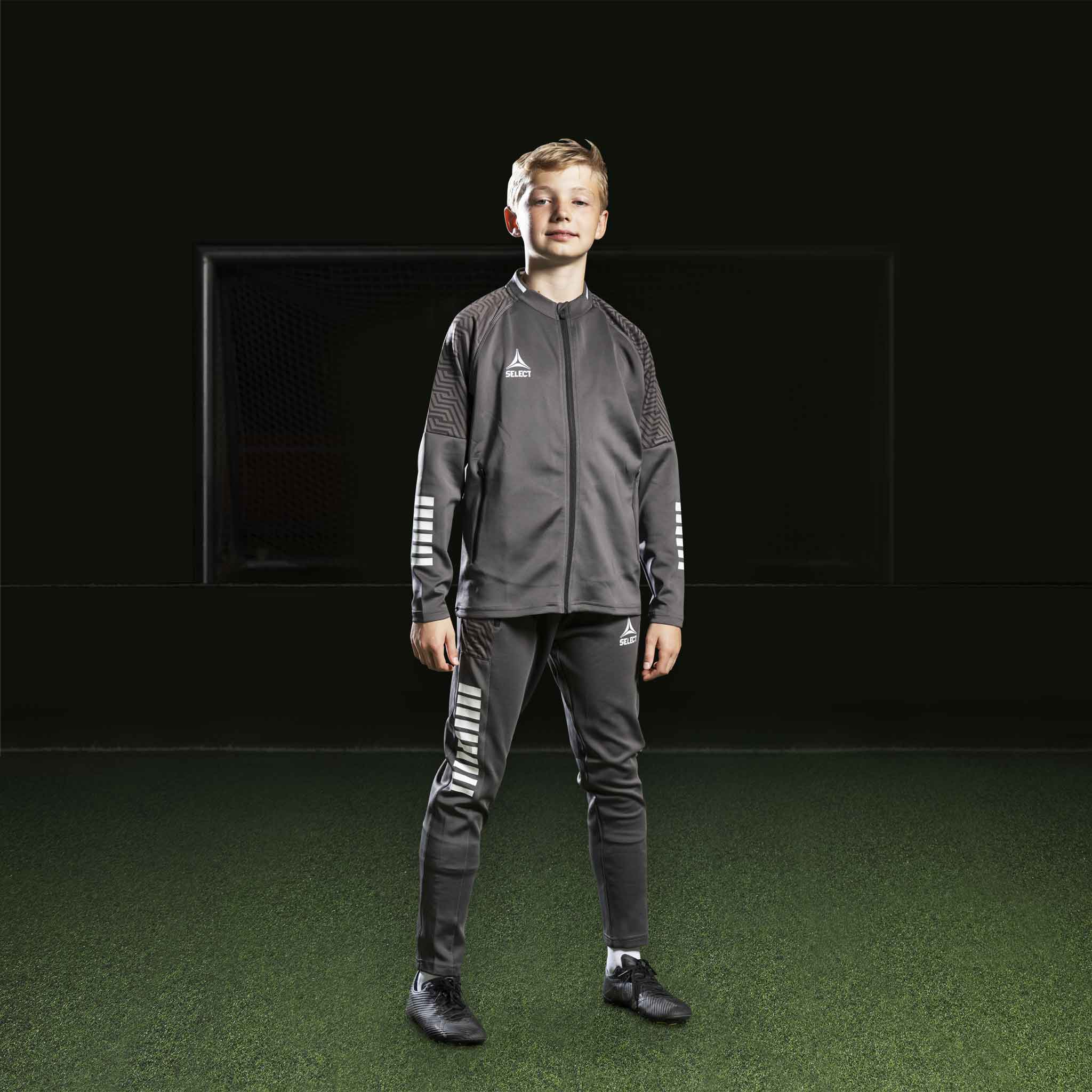 Boy football player in grey and white Zip jacket Monaco v24, Match & Training wear.