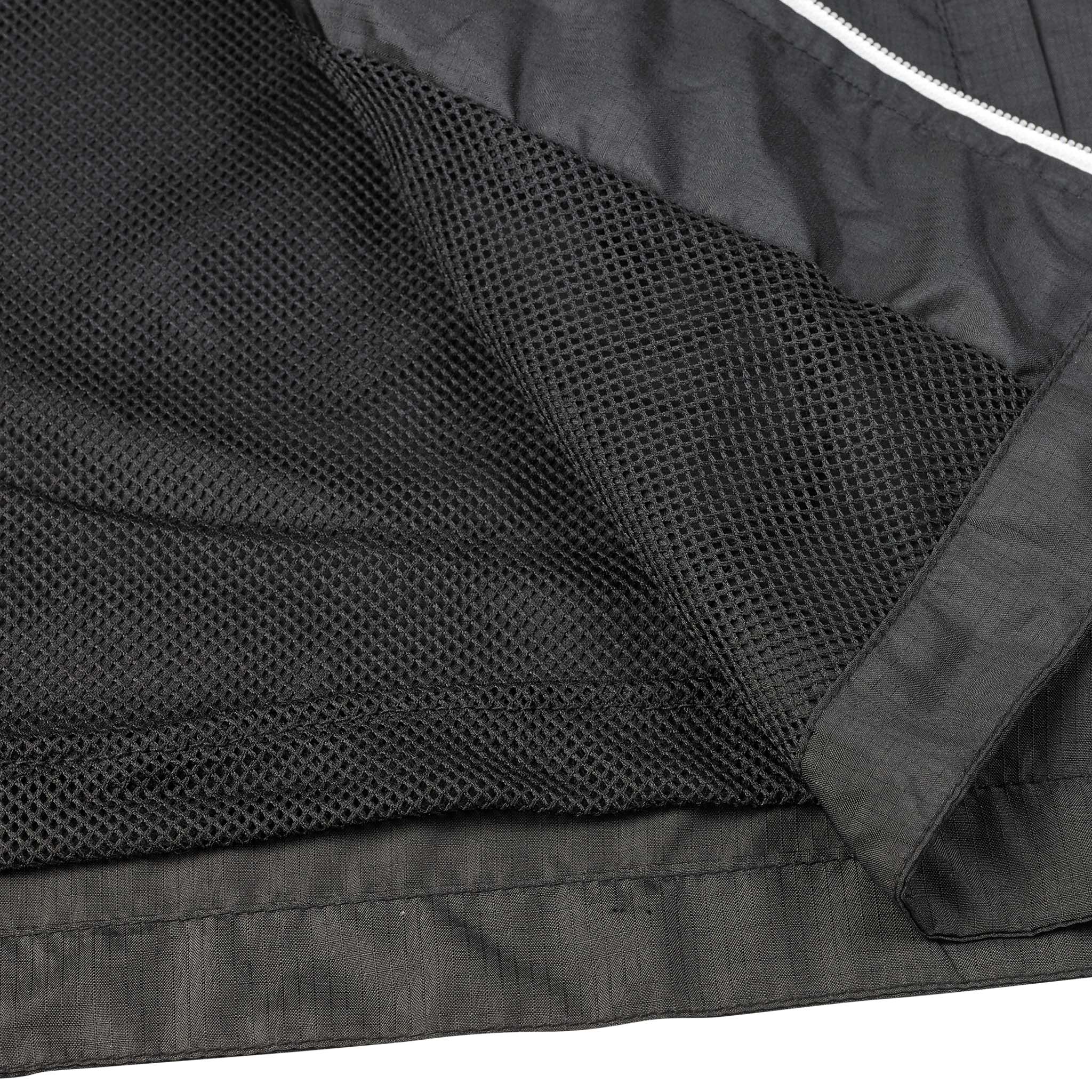 Closeup of black mesh lining and white zip on Training jacket Spain v25, Match & Training wear for football
