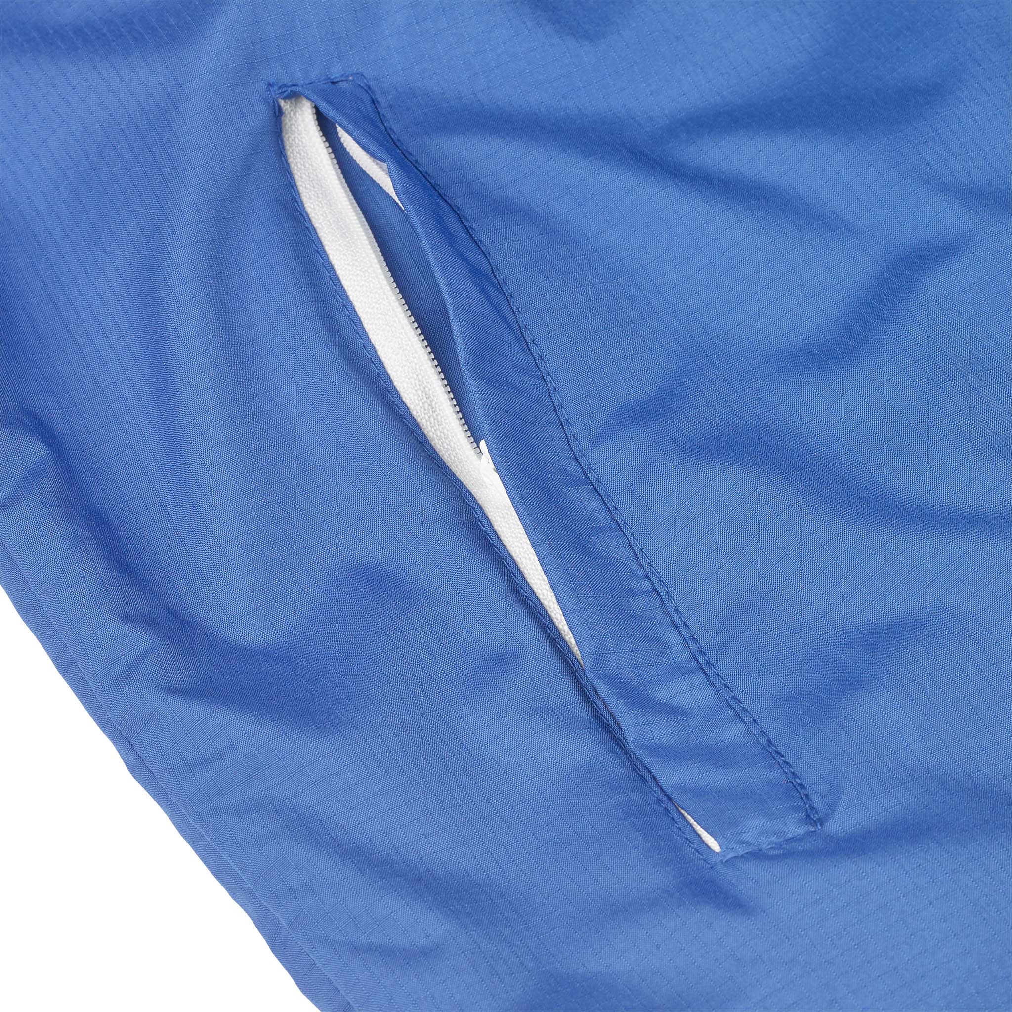 Closeup of blue Training jacket Spain v25, Match & Training wear, showing white zip pocket detail
