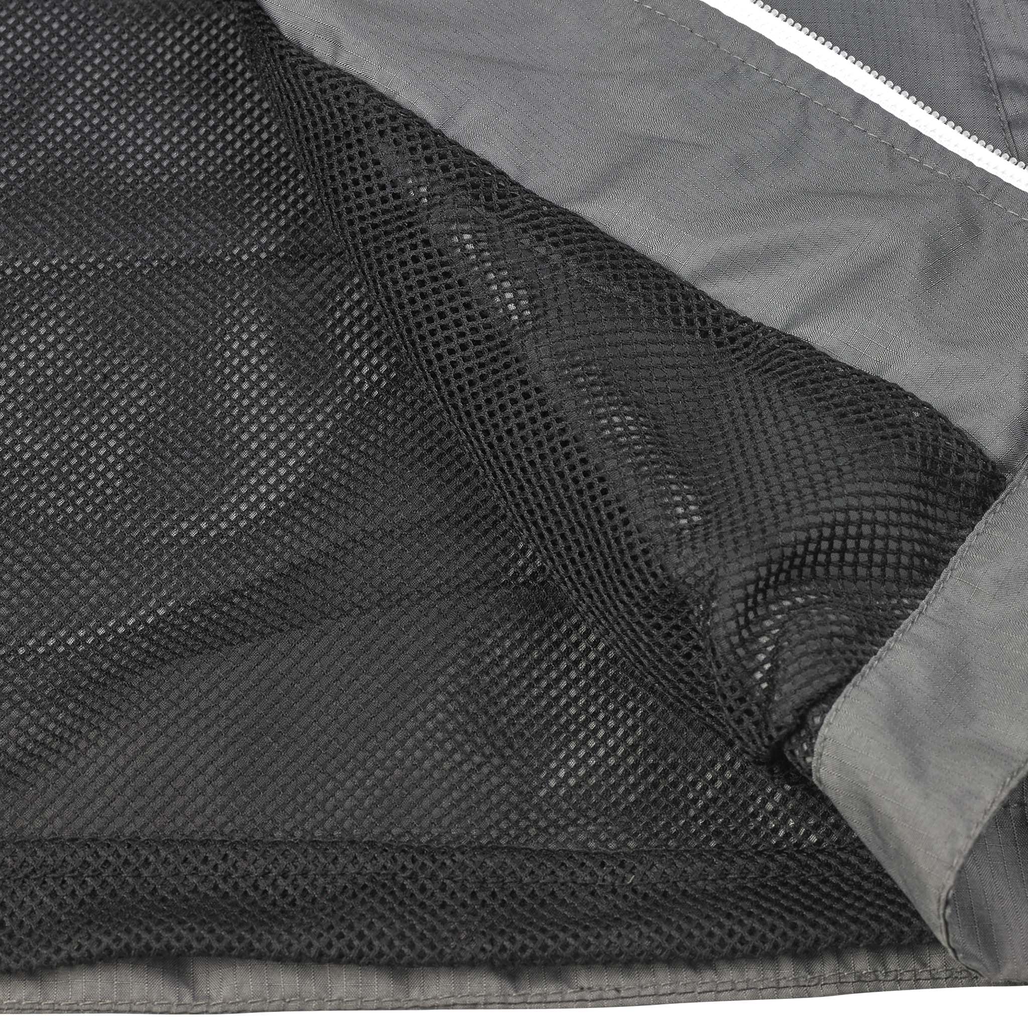 Closeup of grey Training jacket Spain v25, Match & Training wear, showing black mesh inner lining and zip detail.