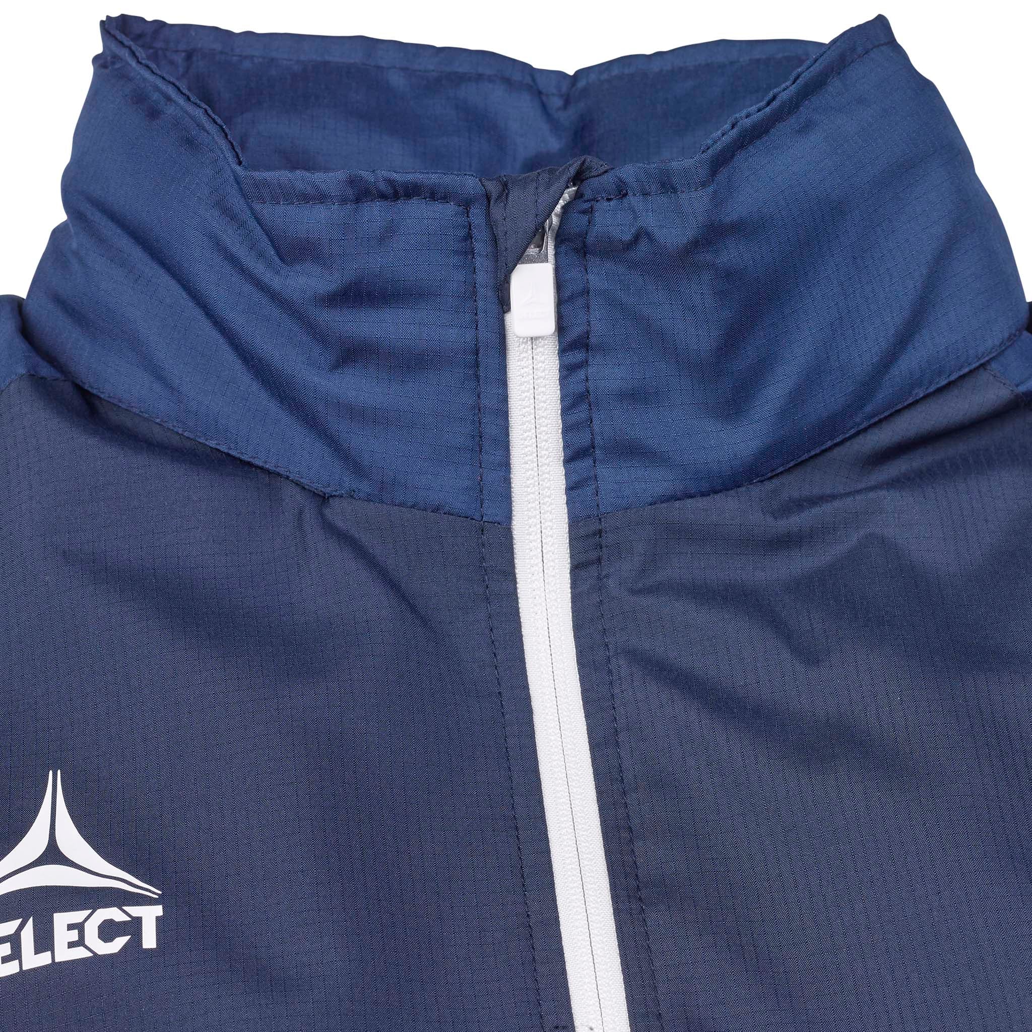 Closeup of navy Training jacket Spain v25, Match & Training wear, white zip and logo detail