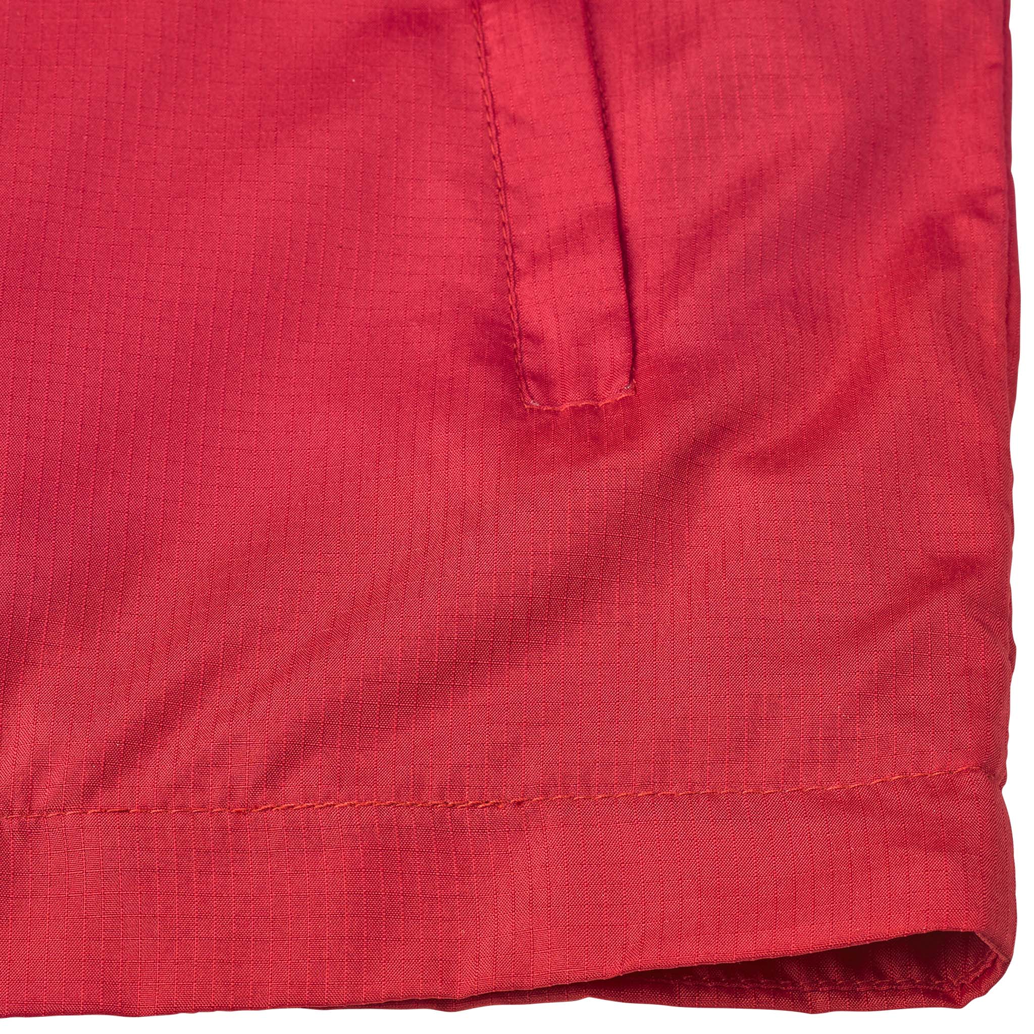 Closeup of red Training jacket Spain v25, Match & Training wear, showing side pocket and hem detail