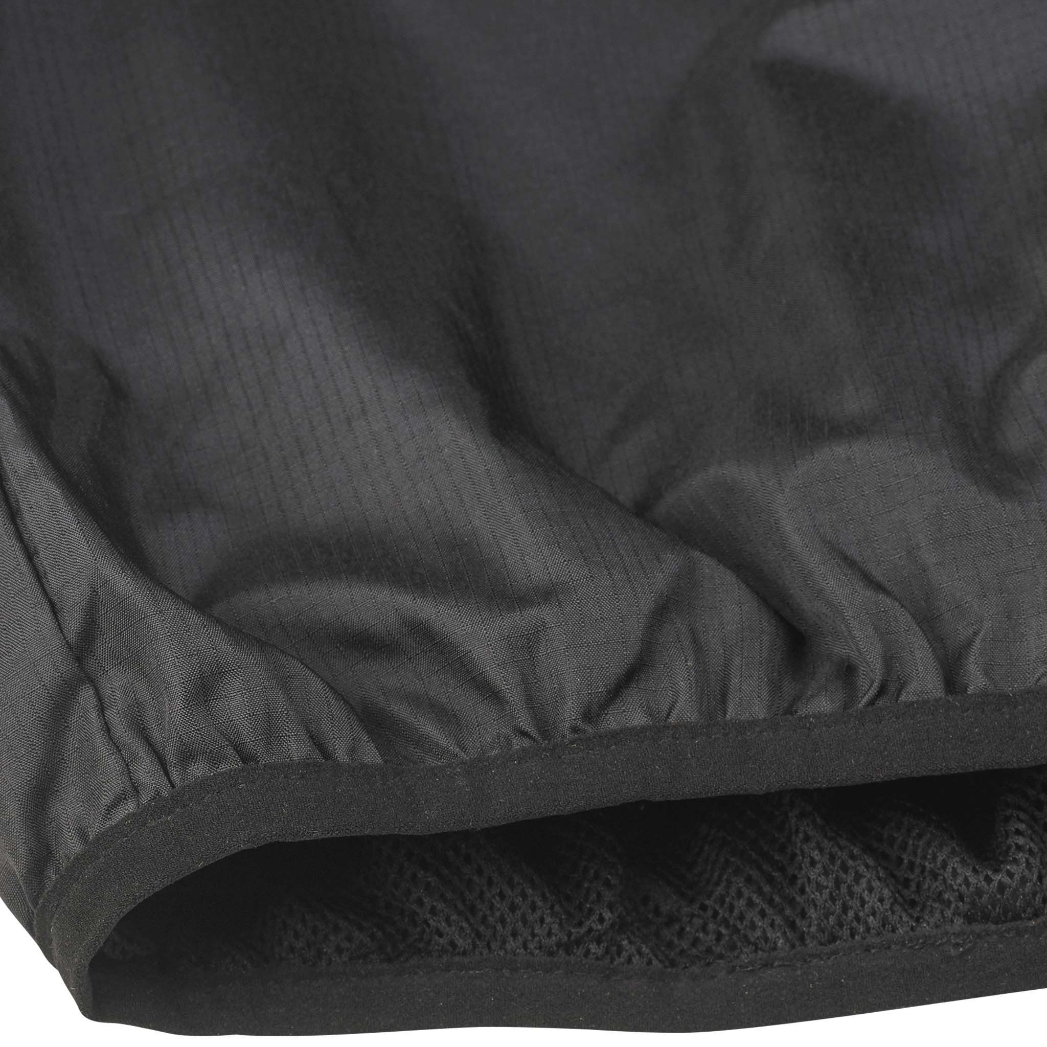 Closeup of black Windbreaker Spain v25, Match & Training football wear, showing elastic hem and mesh lining