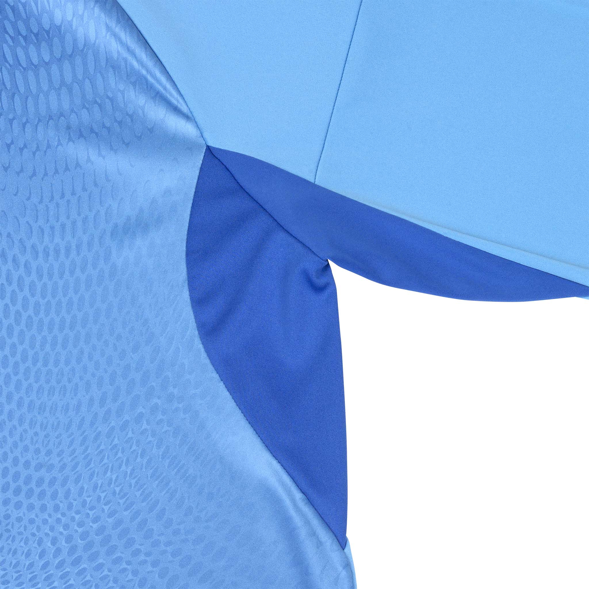 Closeup of blue Goalkeeper shirt Spain v25, goalkeeper wear, showing textured fabric and sleeve detail.