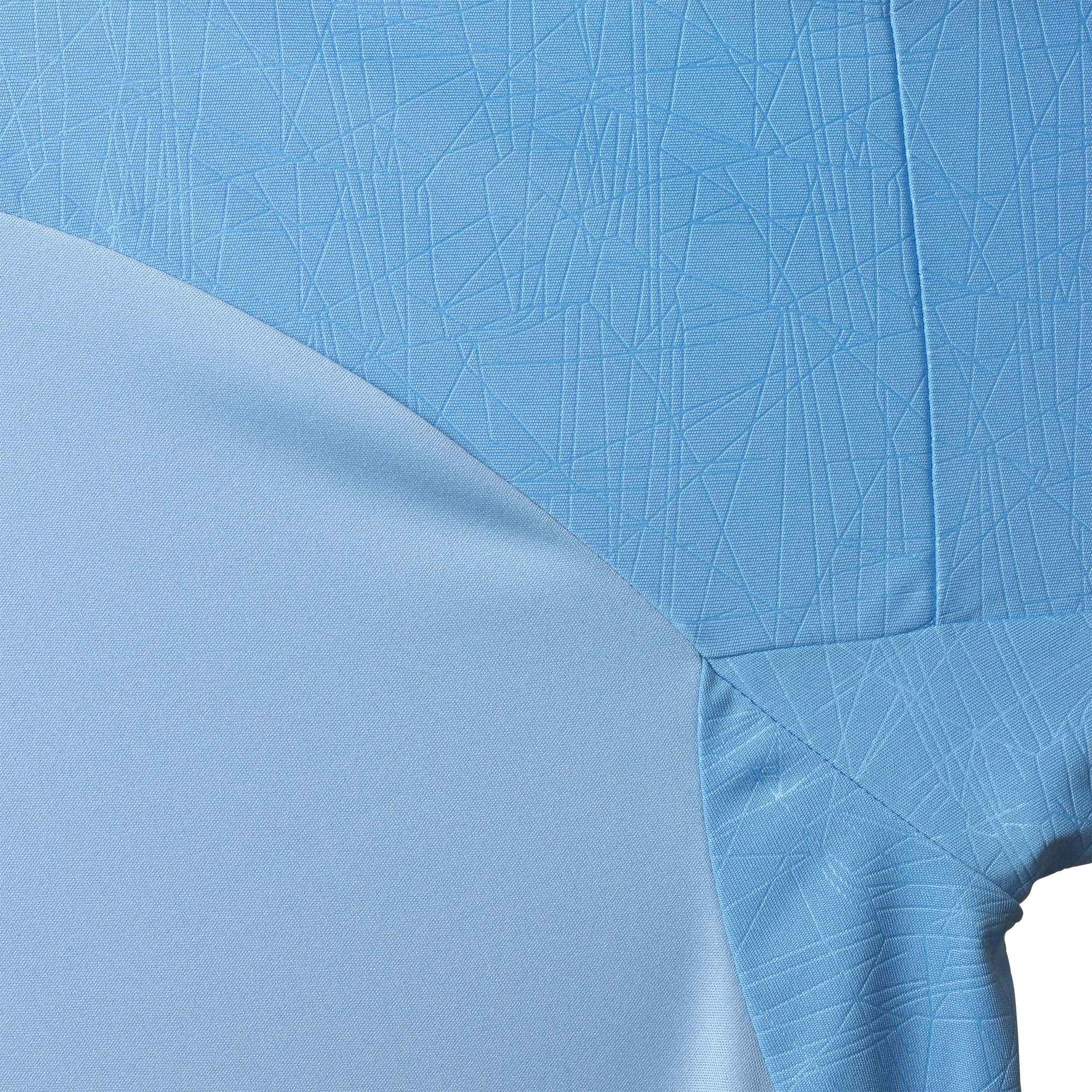 Closeup of Player shirt S/S Spain v25, Match & Training wear, in light blue and white with geometric texture.