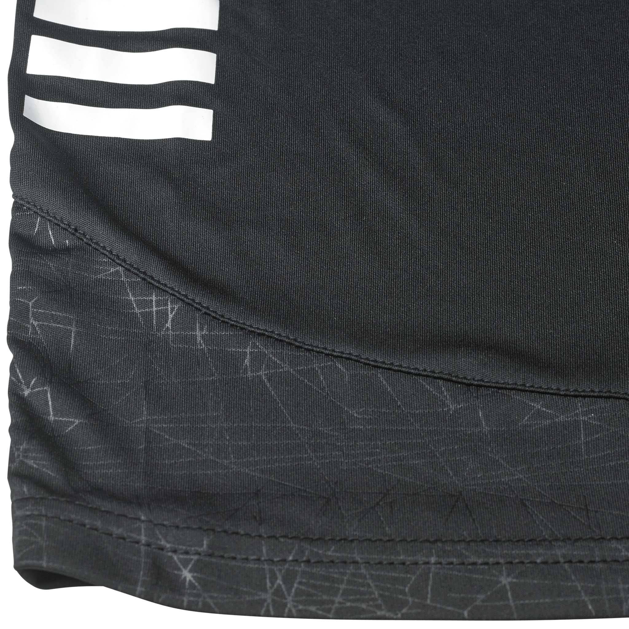 Close-up of Player shorts Spain v25, Match & Training wear, black fabric with white stripes and grey pattern.
