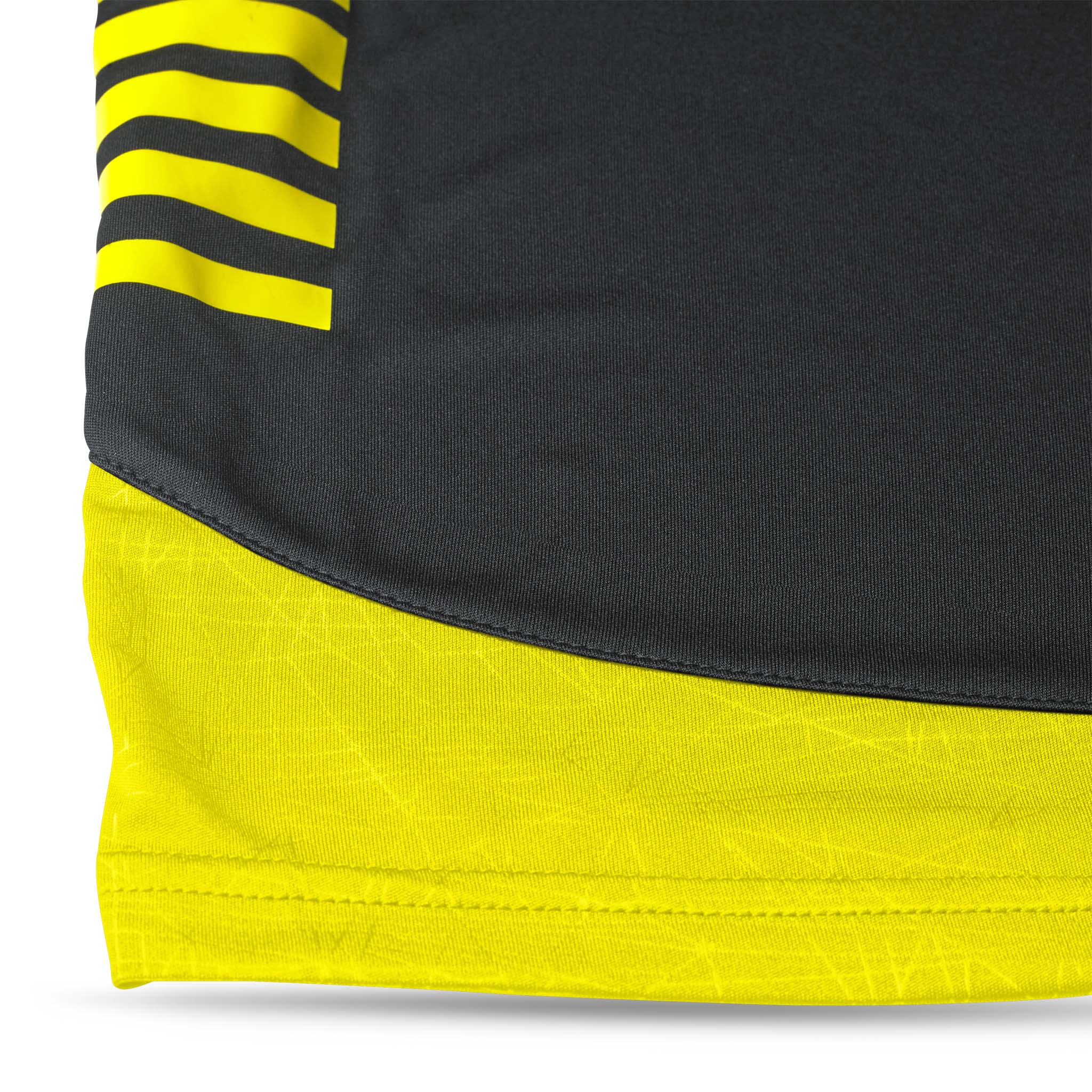 Closeup of Player shorts Spain v25, Match & Training wear, black with yellow stripes and textured panel.