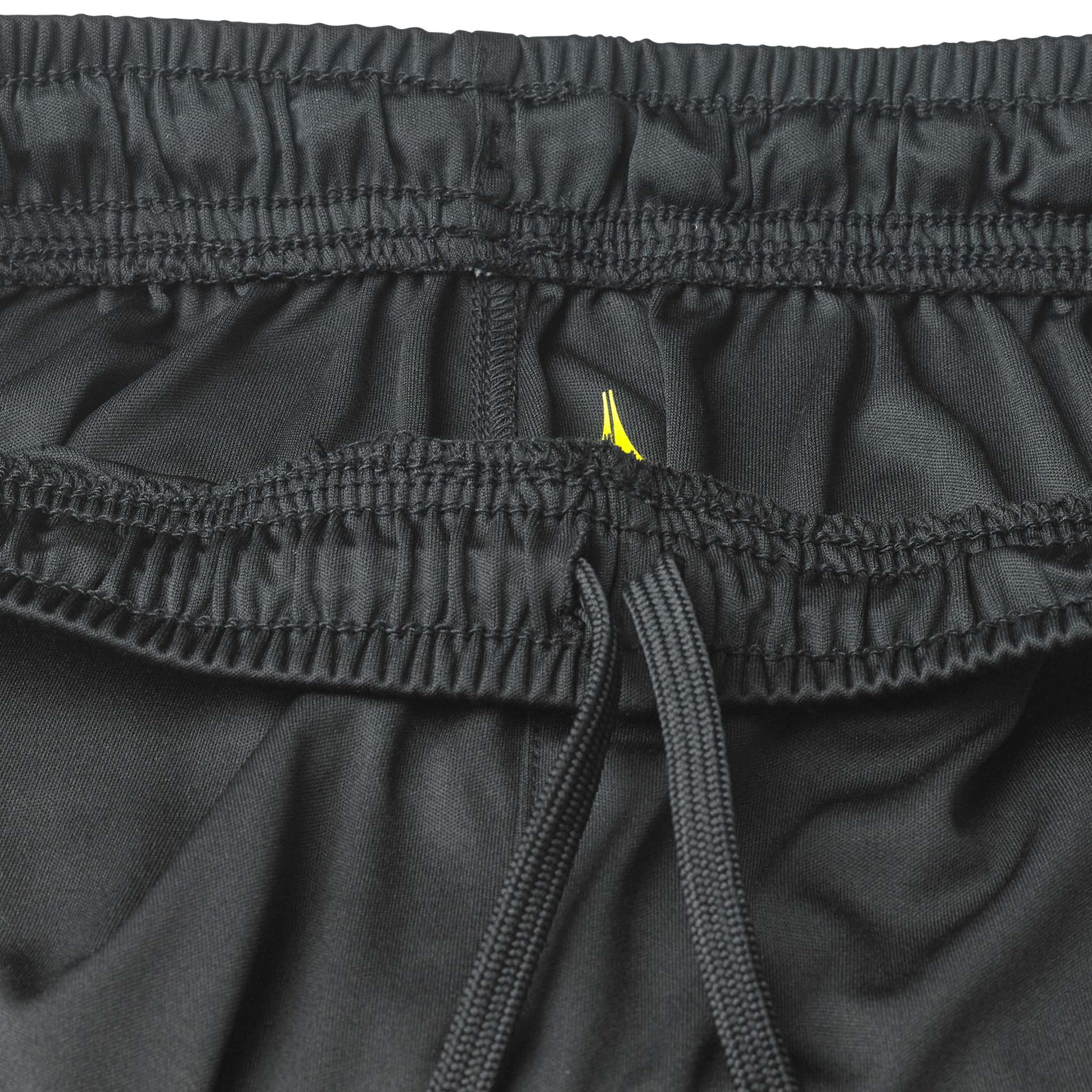 Closeup of black Player shorts Spain v25, Match & Training wear, showing elastic waistband, drawstring and yellow detail