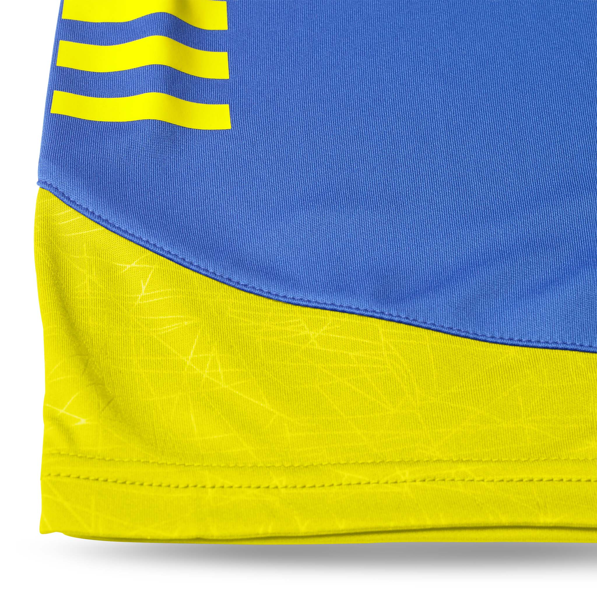 Closeup of blue and yellow Player shorts Spain v25, Match & Training wear, showing fabric detail and football design.