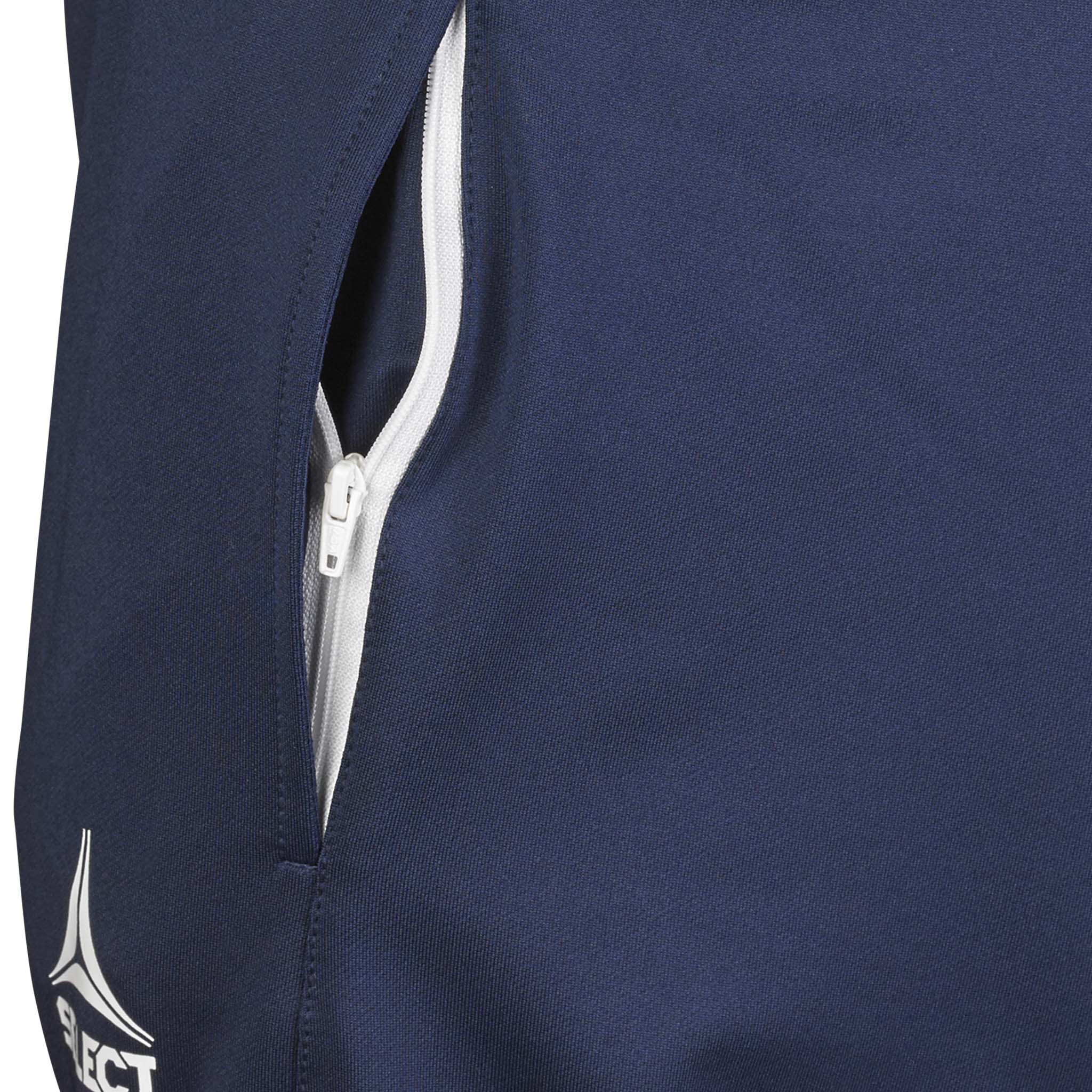 Closeup of navy Training pants regularFit Spain v25, Match & Training wear, showing white zip pocket and logo.