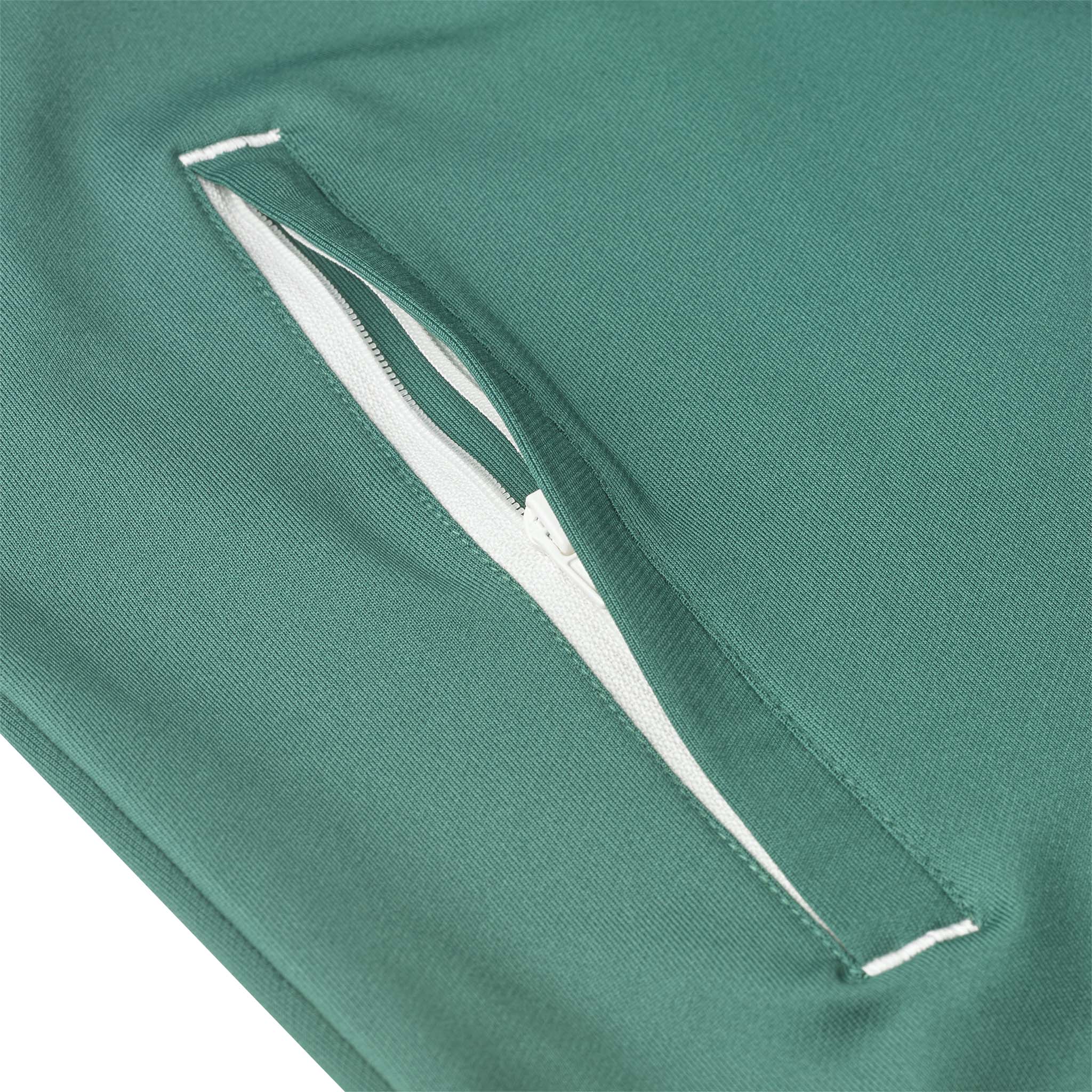Closeup of green Training zip jacket Spain v25, Match & Training wear, showing white zip pocket detail