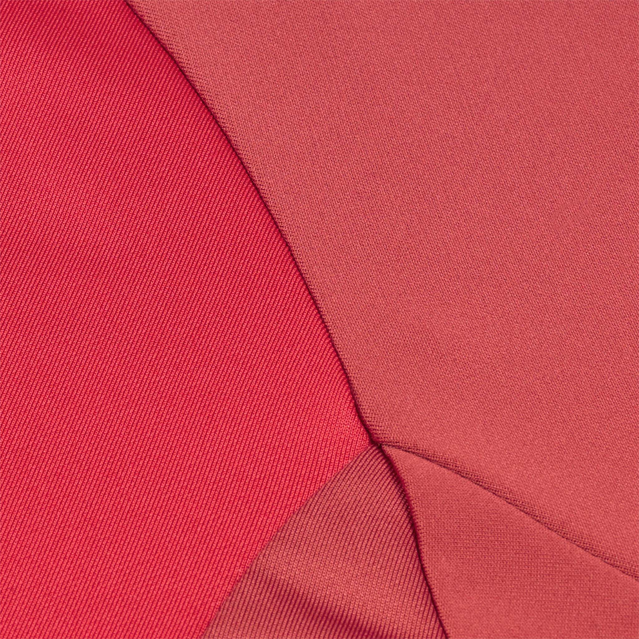 Closeup of red and white Training zip jacket Spain v25, Match & Training football wear, fabric detail