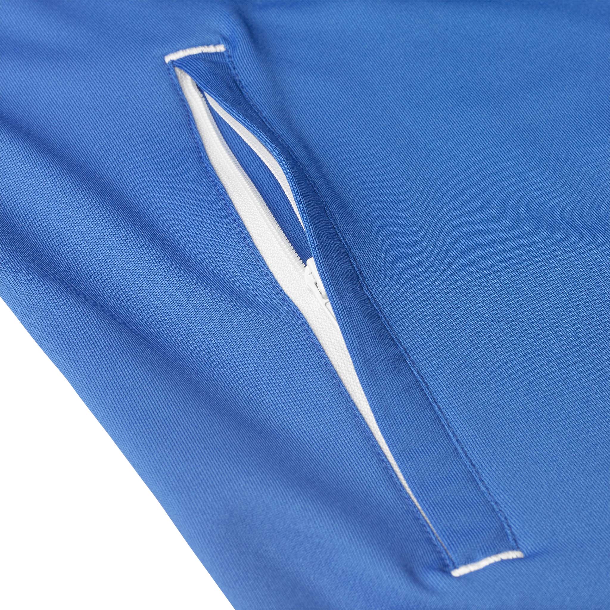 Closeup of blue Training zip jacket Spain woman v25, Match & Training wear, white-trimmed zip pocket