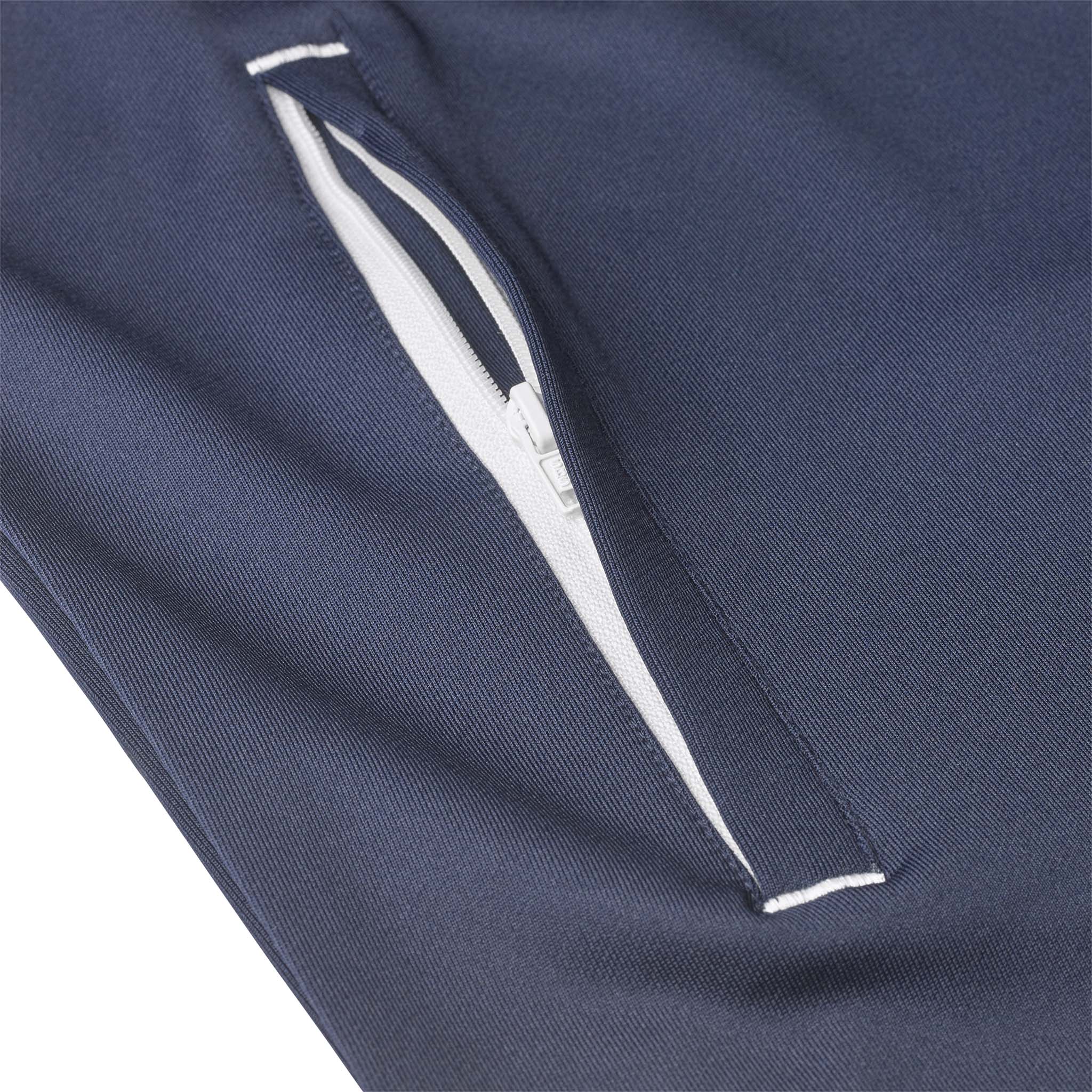 Closeup of navy Training zip jacket Spain woman v25, Match & Training wear, showing white zip pocket detail