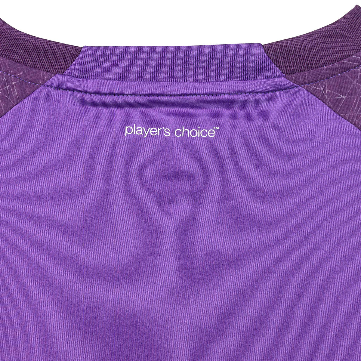 Closeup of purple Player shirt S/S Spain woman v25, Match & Training wear, showing white "player's choice" text and ribbed collar.
