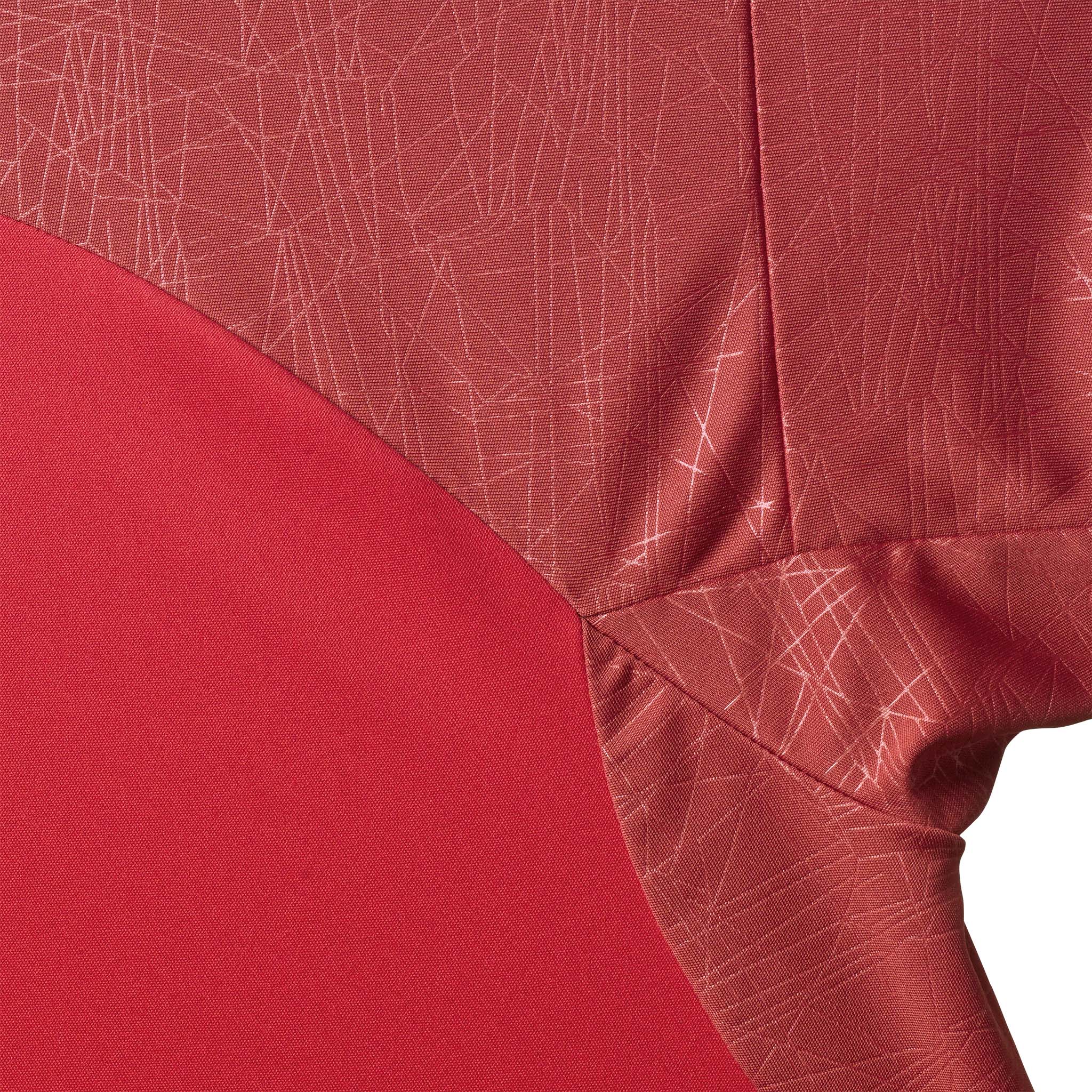 Closeup of Player shirt S/S Spain woman v25, Match & Training wear, in red with white geometric pattern.
