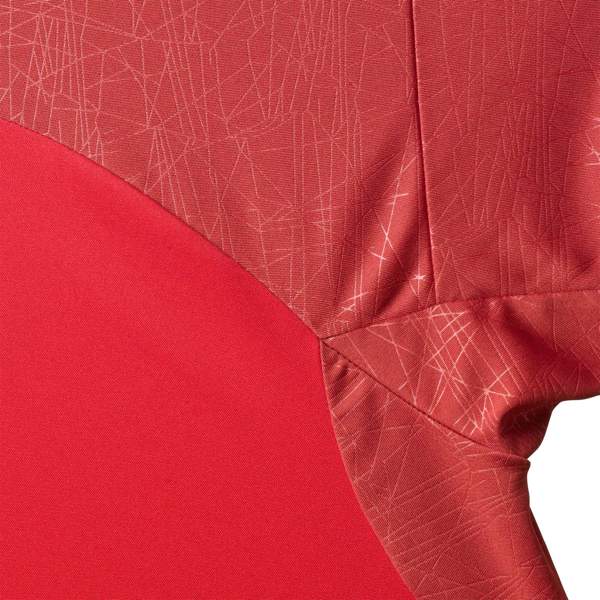 Closeup of Player shirt S/S Spain woman v25, Match & Training wear, in red with white geometric pattern.