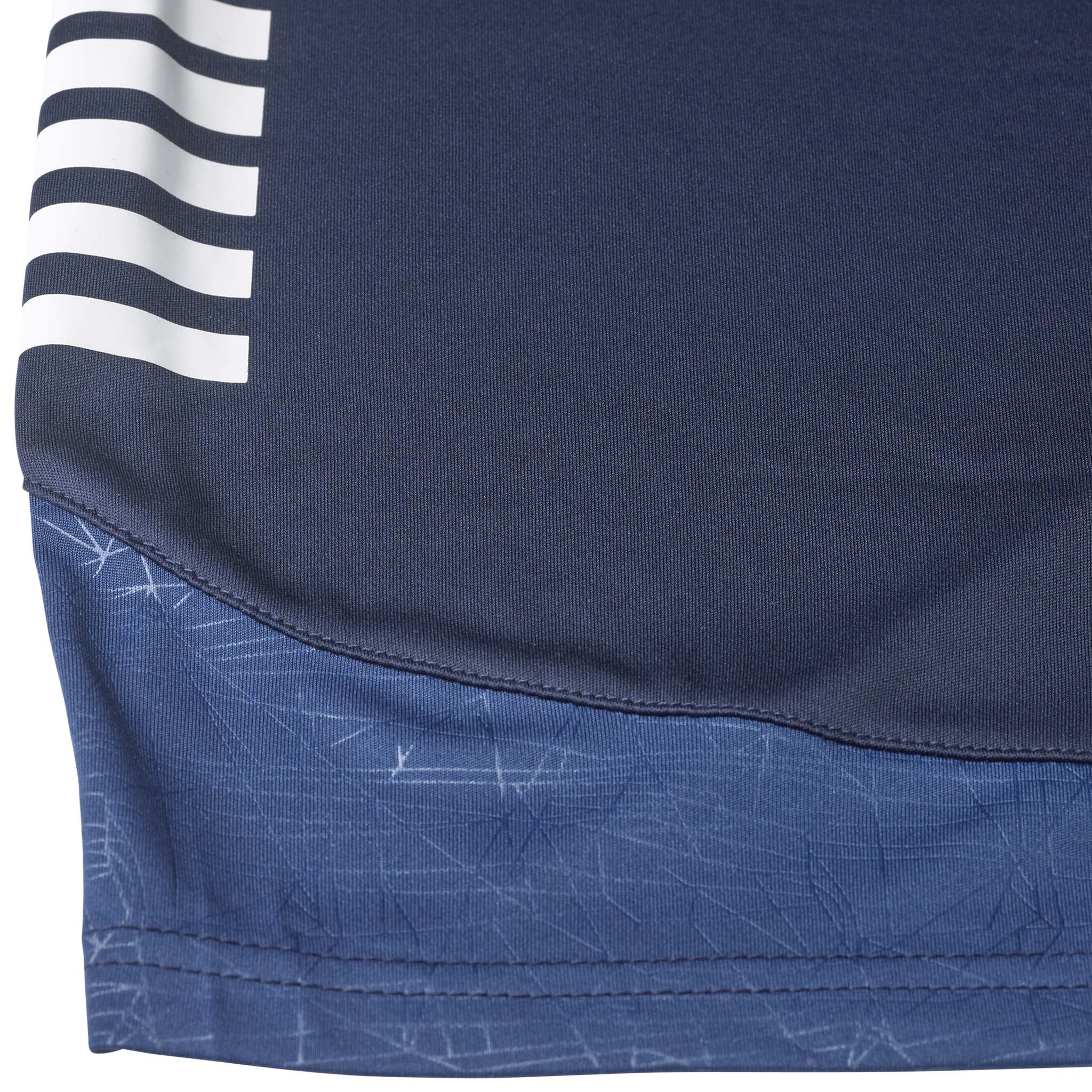 Closeup of navy Player shorts Spain woman v25, Match & Training wear, with white stripes and blue patterned hem detail.