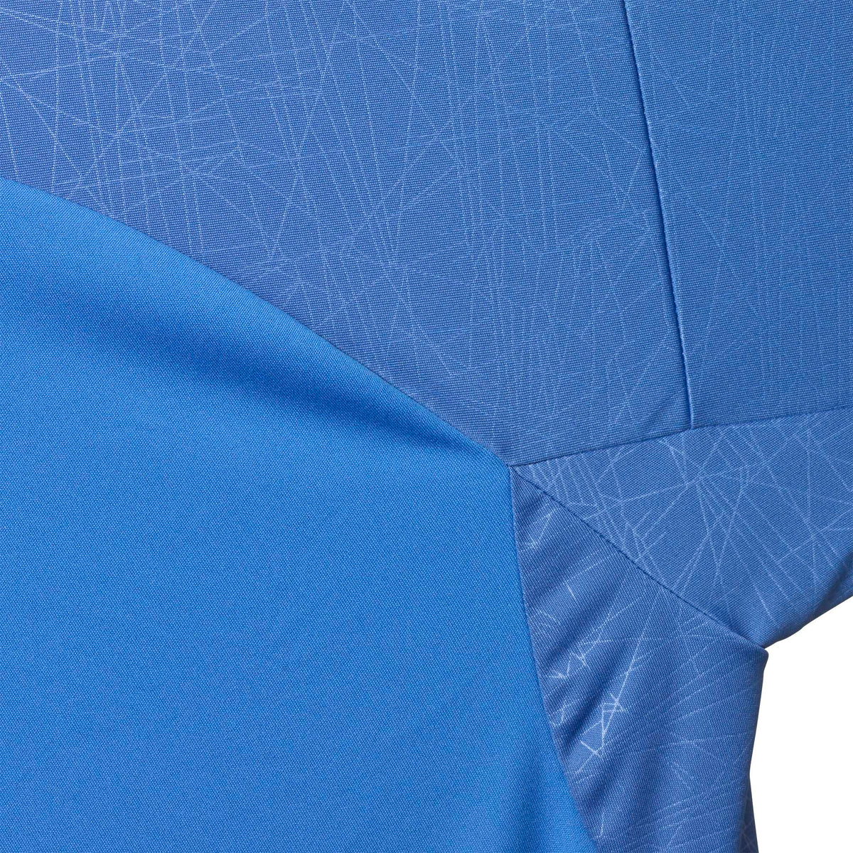 Closeup of Player shirt S/S Spain woman v25, Match & Training wear, blue with subtle line pattern and white side panel