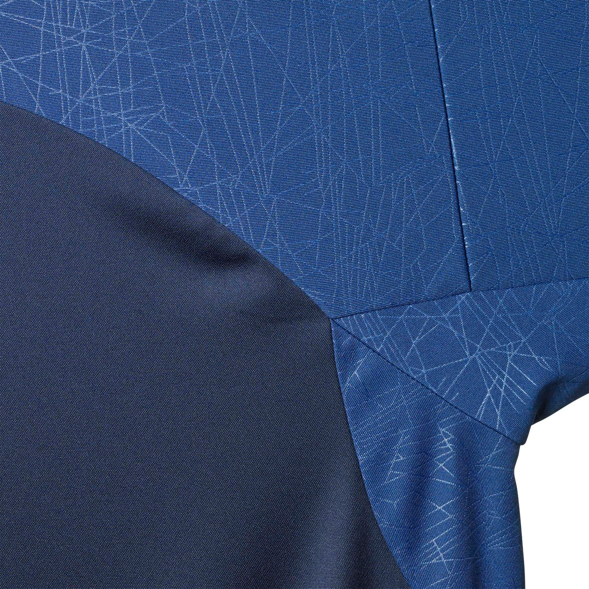 Closeup of Player shirt S/S Spain woman v25, Match & Training wear, in navy and blue with line pattern.