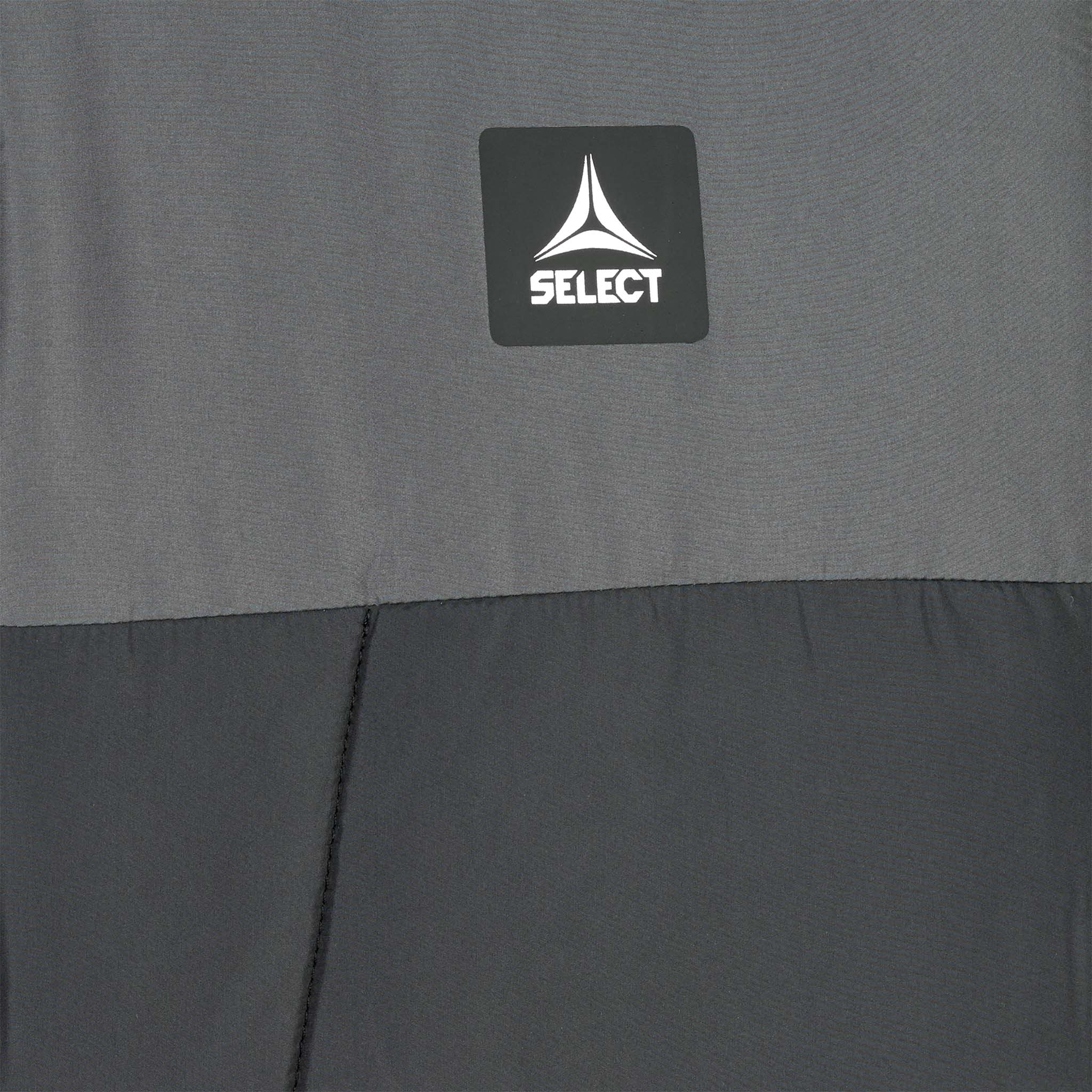 Closeup of Padded jacket Oxford v25 leisure wear, showing grey and black fabric with Select logo on chest.