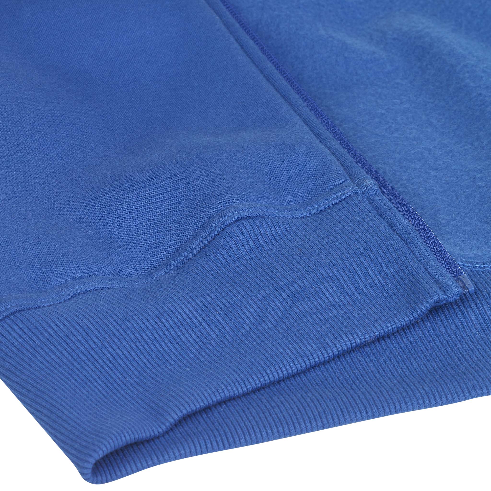 Closeup of blue Zip hoodie Oxford v25 leisure wear, showing ribbed hem and soft fabric detail.