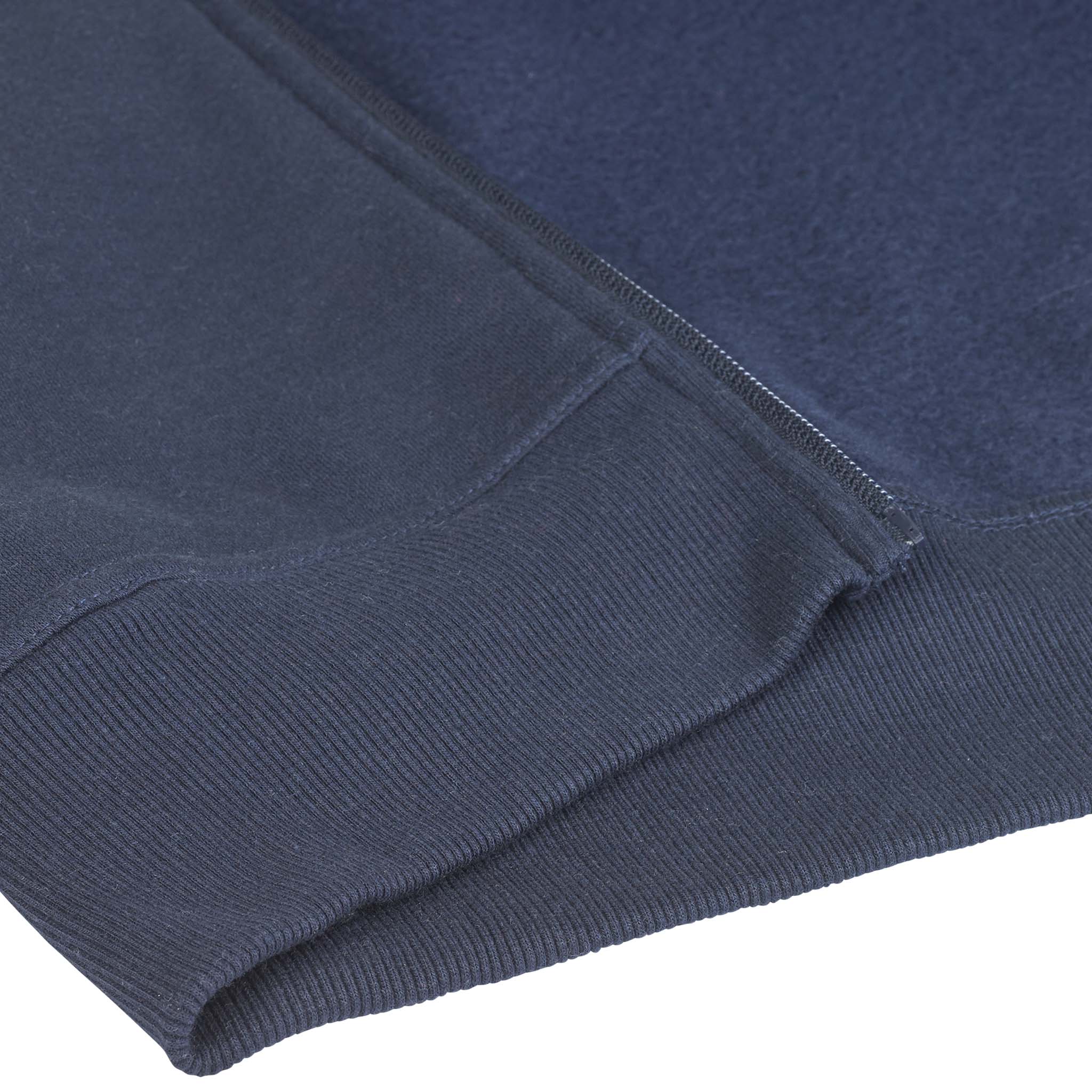 Closeup of navy Zip hoodie Oxford v25 leisure wear, showing zipper, ribbed hem and pocket detail.