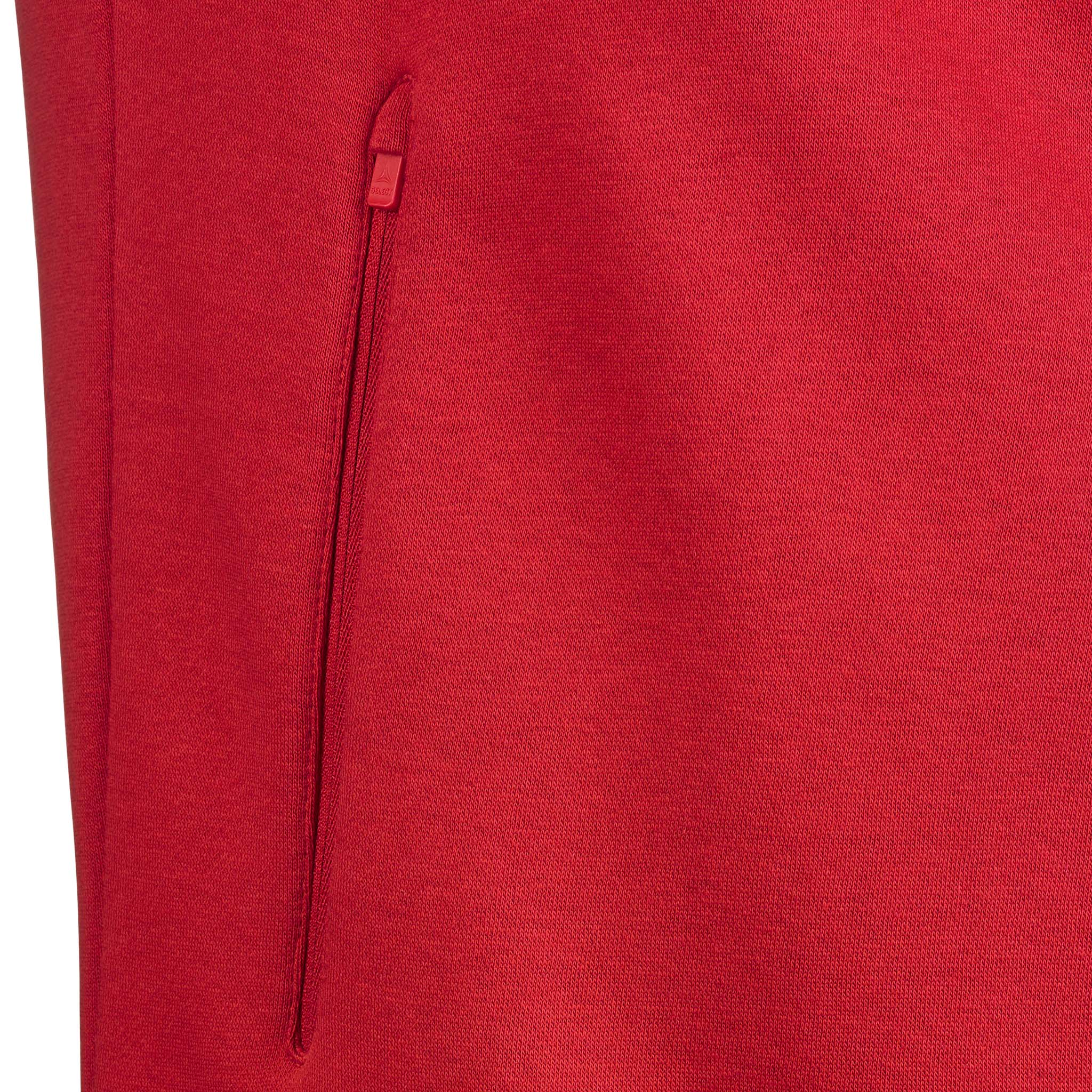 Closeup of red Zip hoodie Oxford v25 leisure wear, showing the zippered pocket detail.