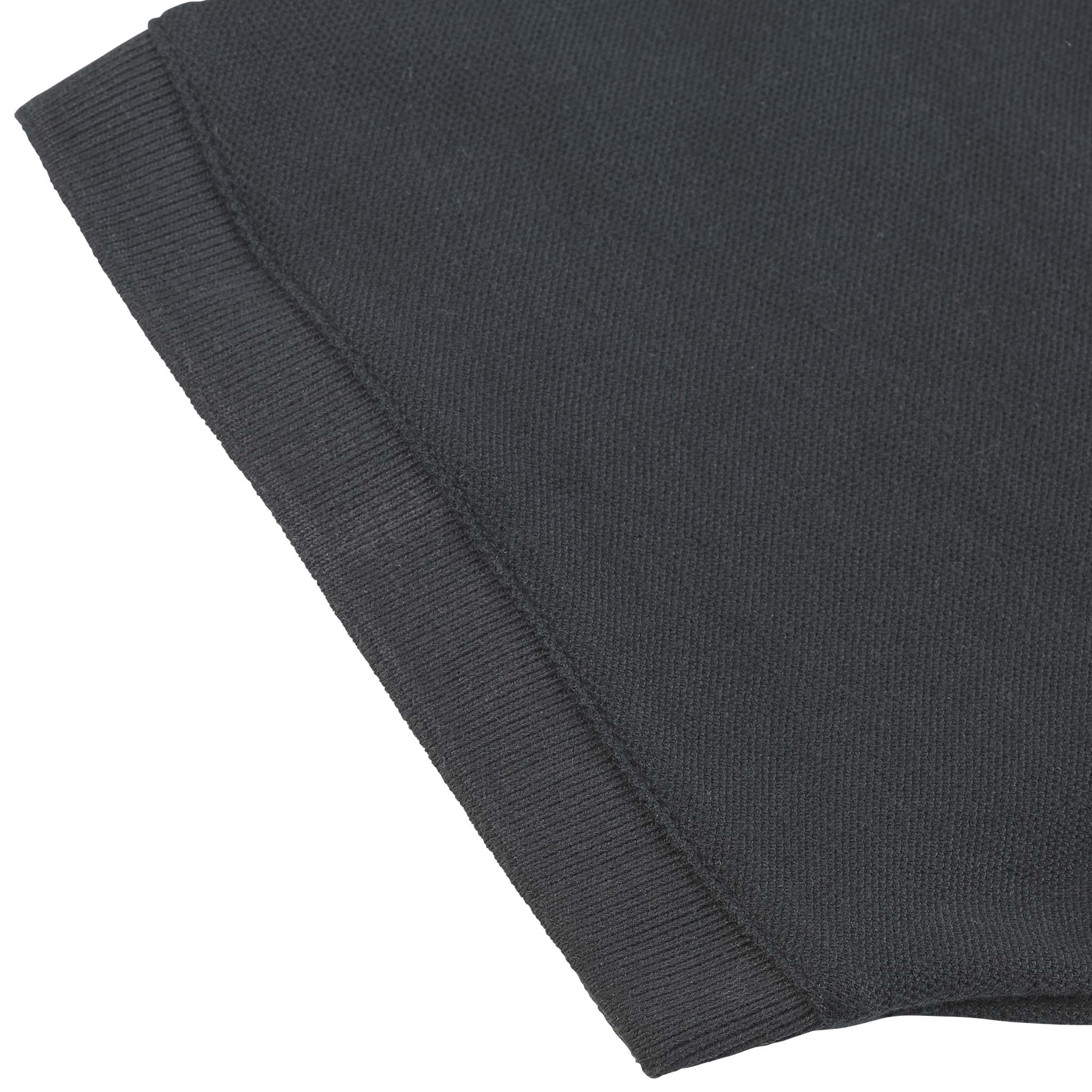 Closeup of black Polo t-shirt Oxford v25, leisure wear, showing ribbed hem detail and fabric texture.