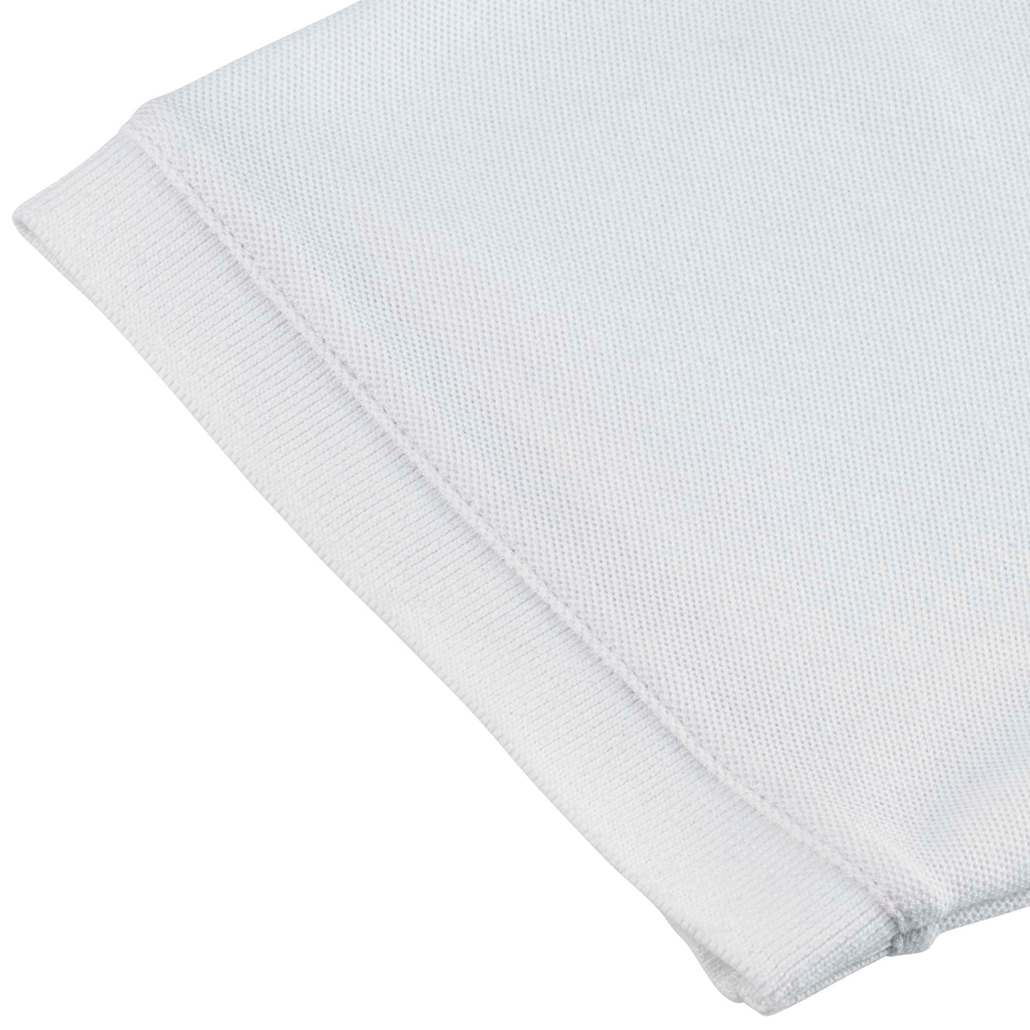 Closeup of white Polo t-shirt Oxford v25, leisure wear, showing ribbed sleeve cuff and textured fabric detail.