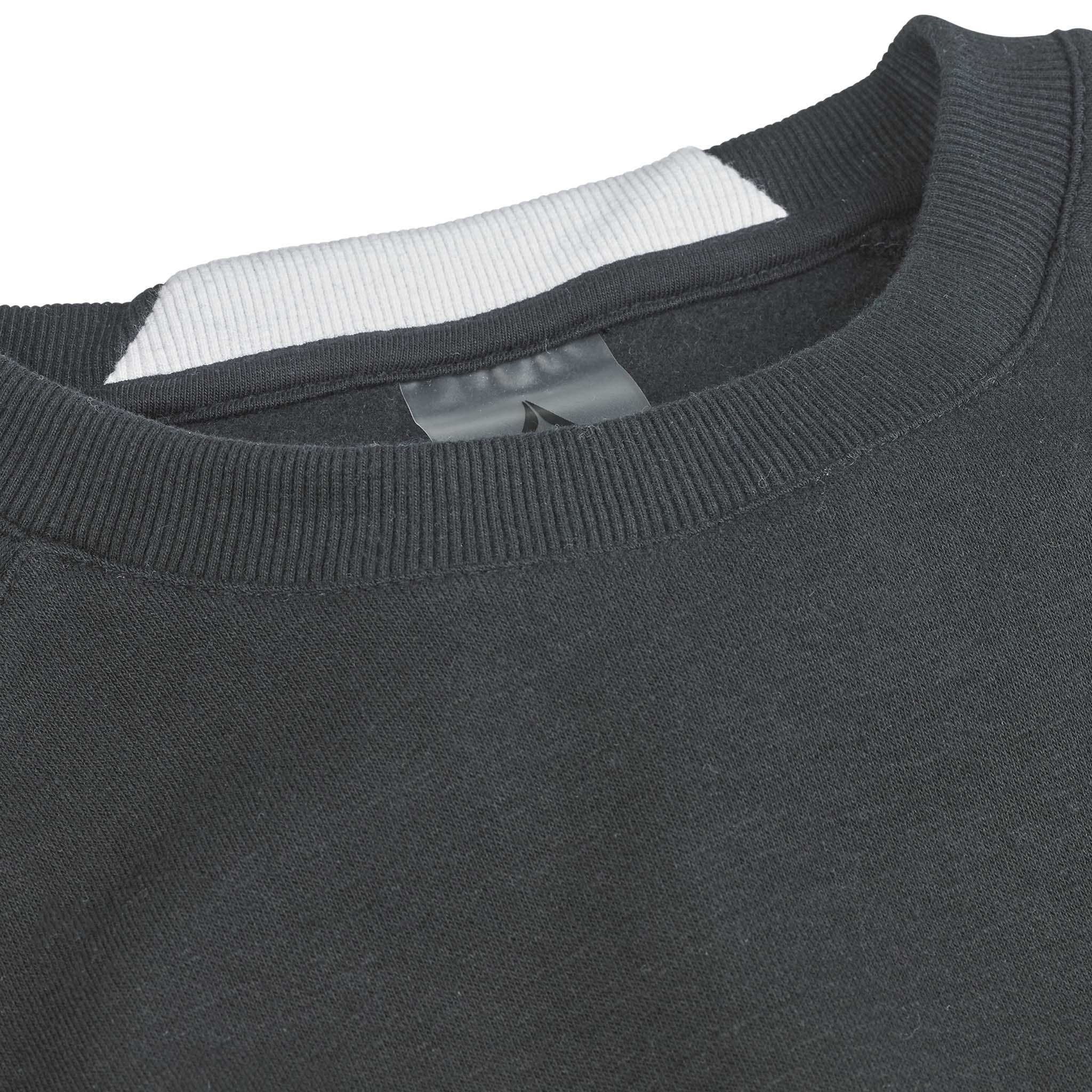 Closeup of black Sweat Oxford v25 leisure wear, showing ribbed crew neck and inner label detail.