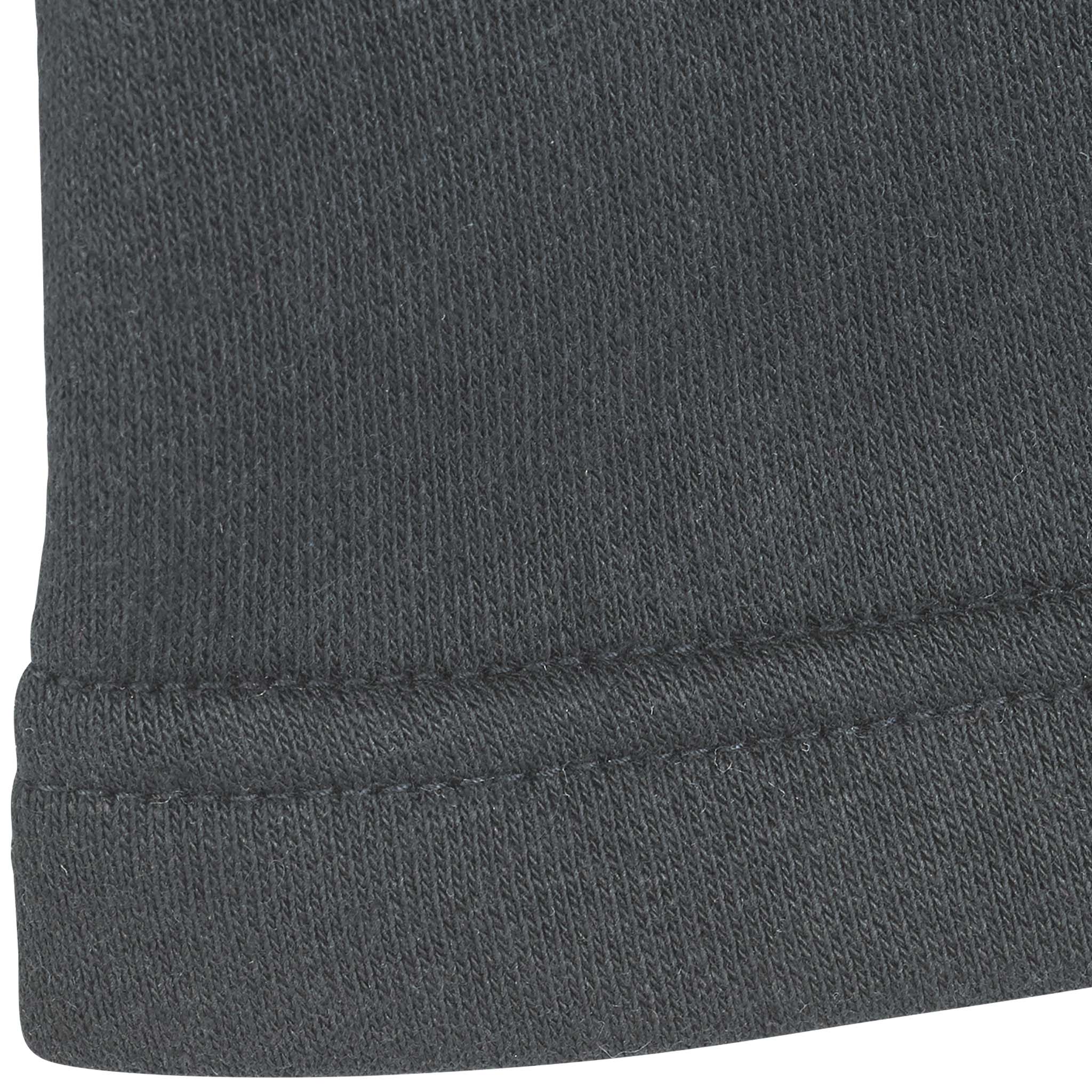 Closeup of black Zip jacket Oxford v25 leisure wear, showing ribbed cuff and stitched seam detail.