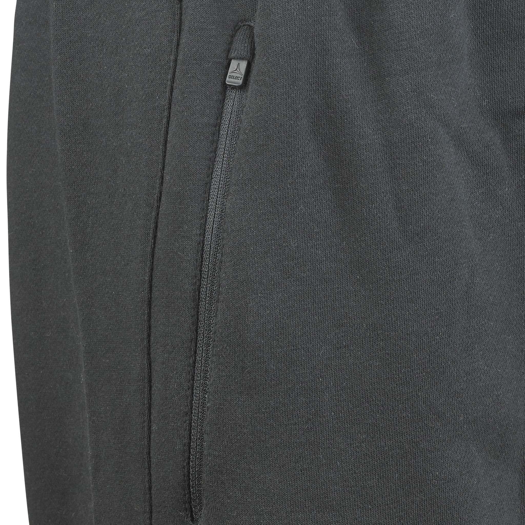 Closeup of black Sweat pants Oxford v25 leisure wear, showing the zipped side pocket detail.