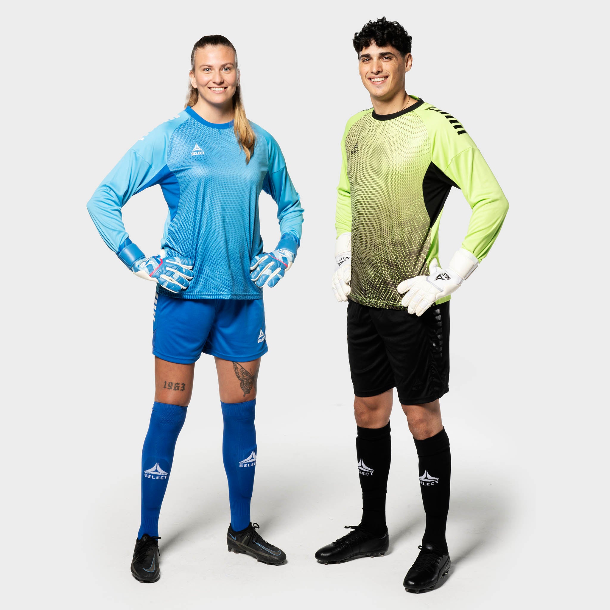 Football players wearing Goalkeeper shirt Spain v25 in blue and lime green, goalkeeper wear, front view.