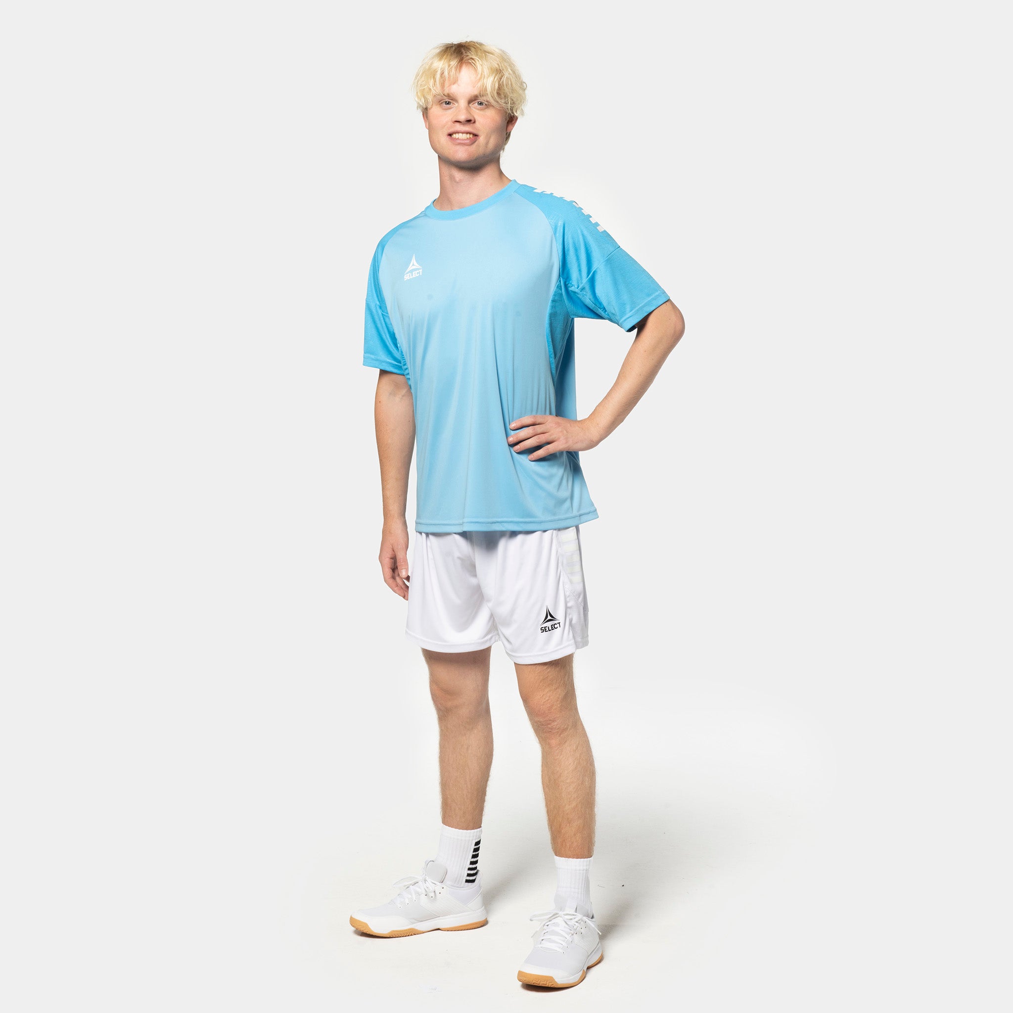 Male football player in light blue shirt and white Player shorts Spain v25, Match & Training wear.