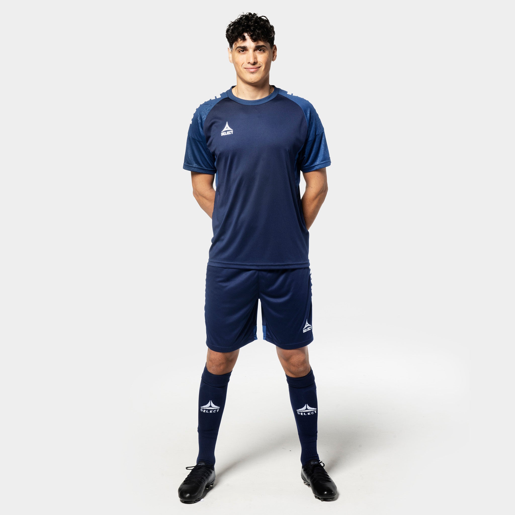 Male football player in navy Player shorts Spain v25, Match & Training wear, front view.