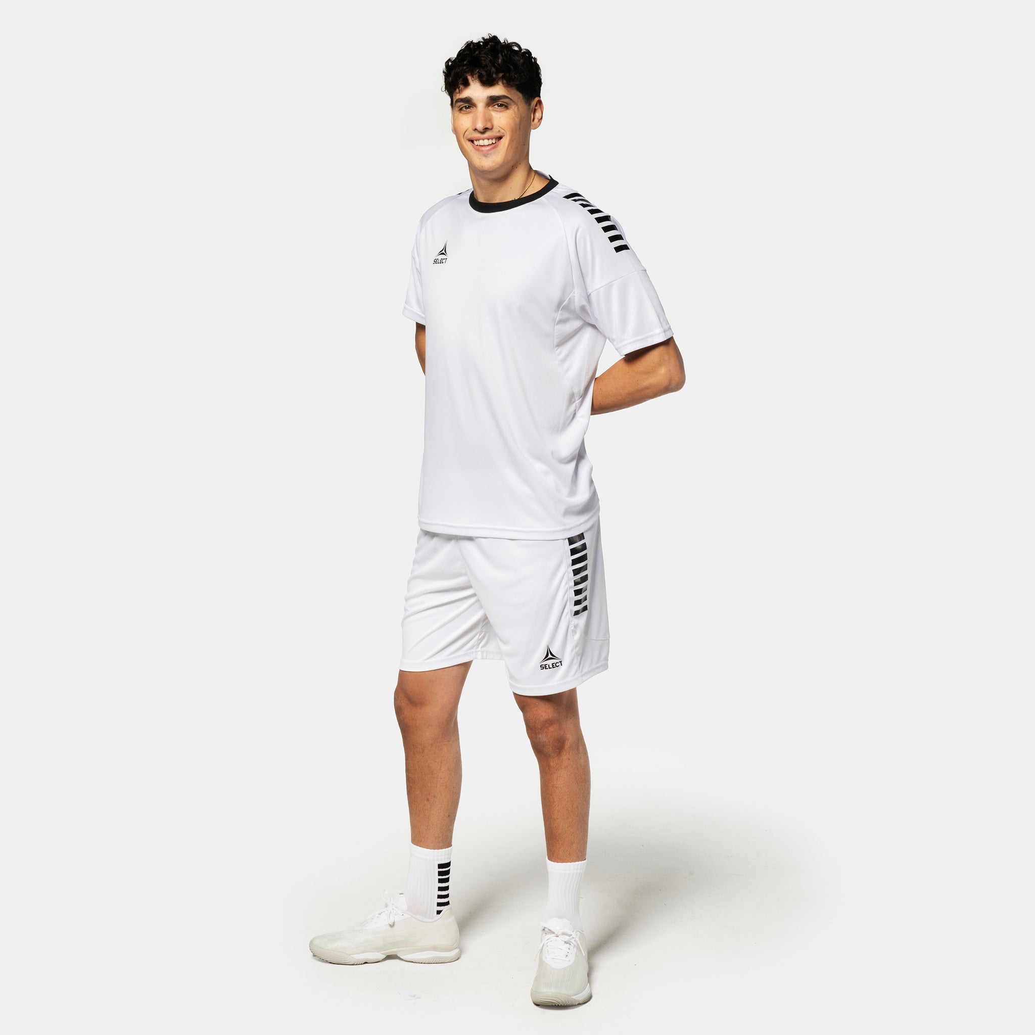 Male football player in white Player shorts Spain v25 with black trim, Match & Training wear, front view.