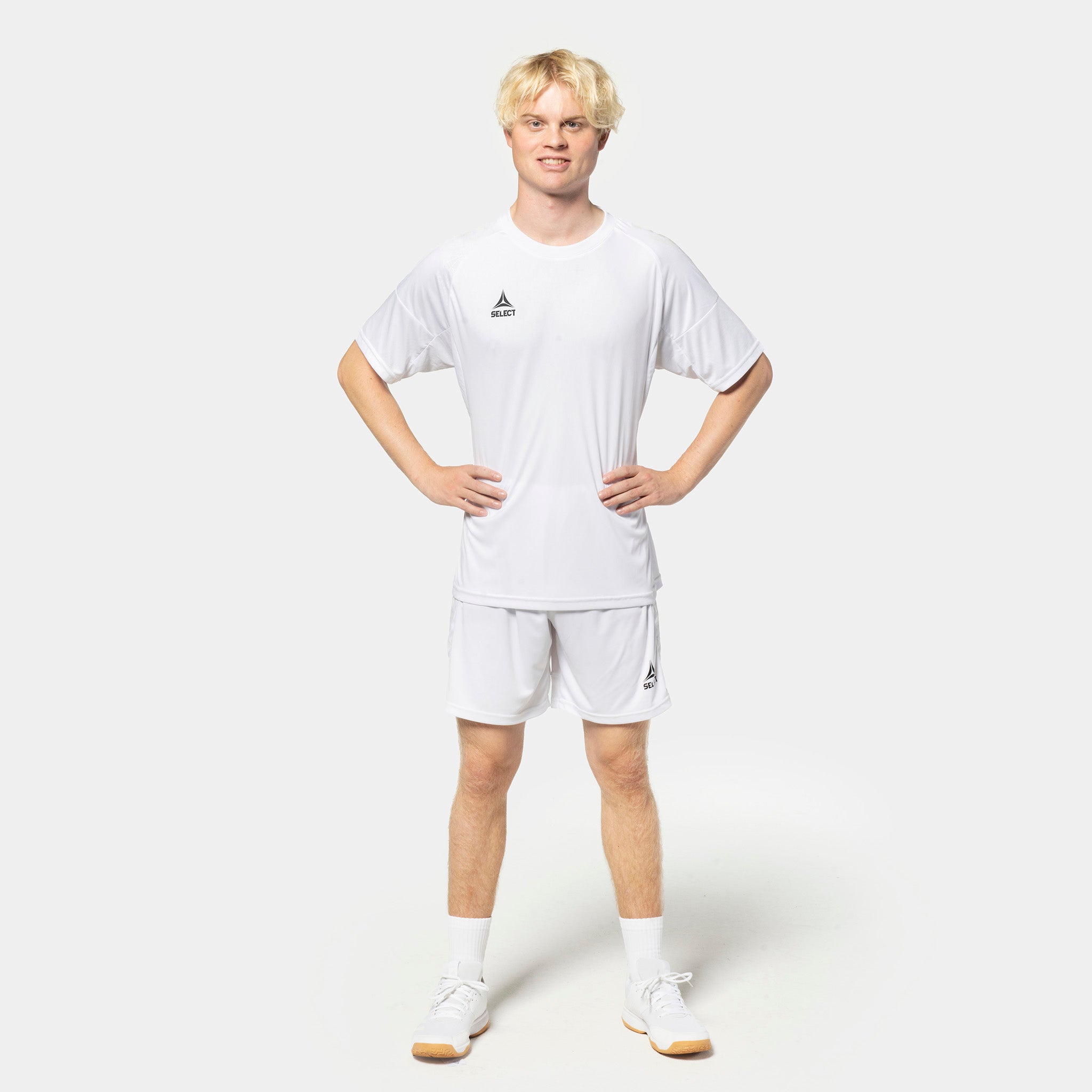 Male football player in white Player shorts Spain v25 and matching shirt, Match & Training wear, front view.