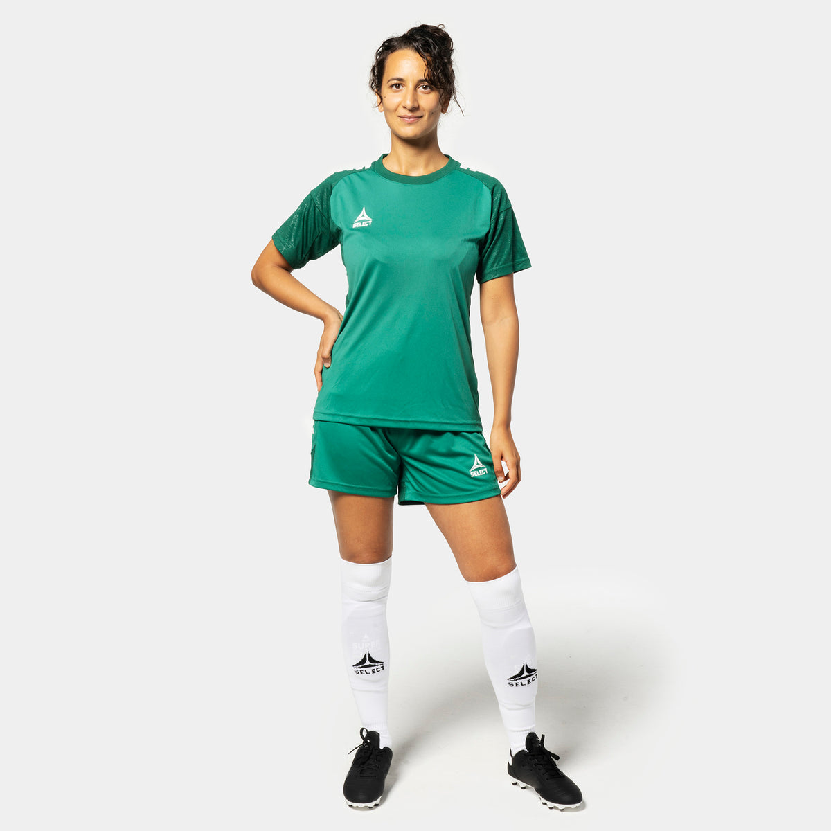 Woman football player in green and white Player shirt S/S Spain woman v25 and shorts v25, Match & Training wear, front view