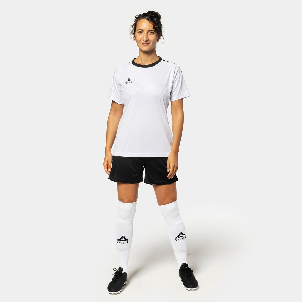 Woman football player in white Player shirt S/S Spain woman v25 & black shorts, Match & Training wear, front view