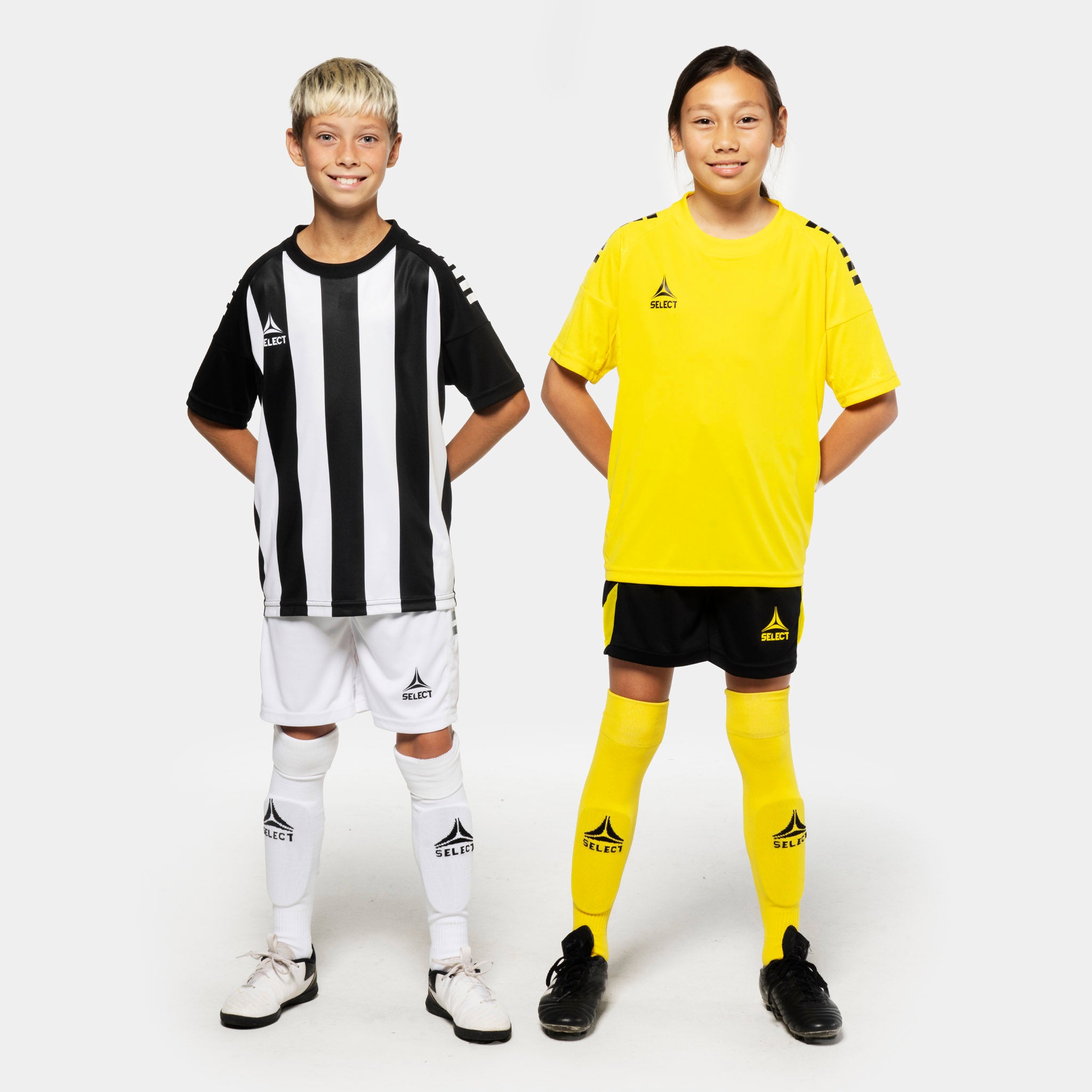 Boy football players in Player shirt S/S Spain striped v25, Match & Training wear, black/white and yellow kits, front view.