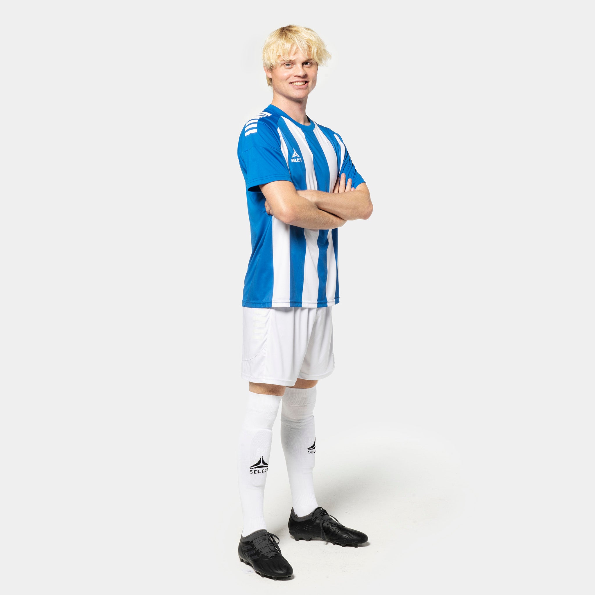 Male football player in blue and white striped Player shirt S/S Spain striped v25, white shorts and socks. Match & Training wear.