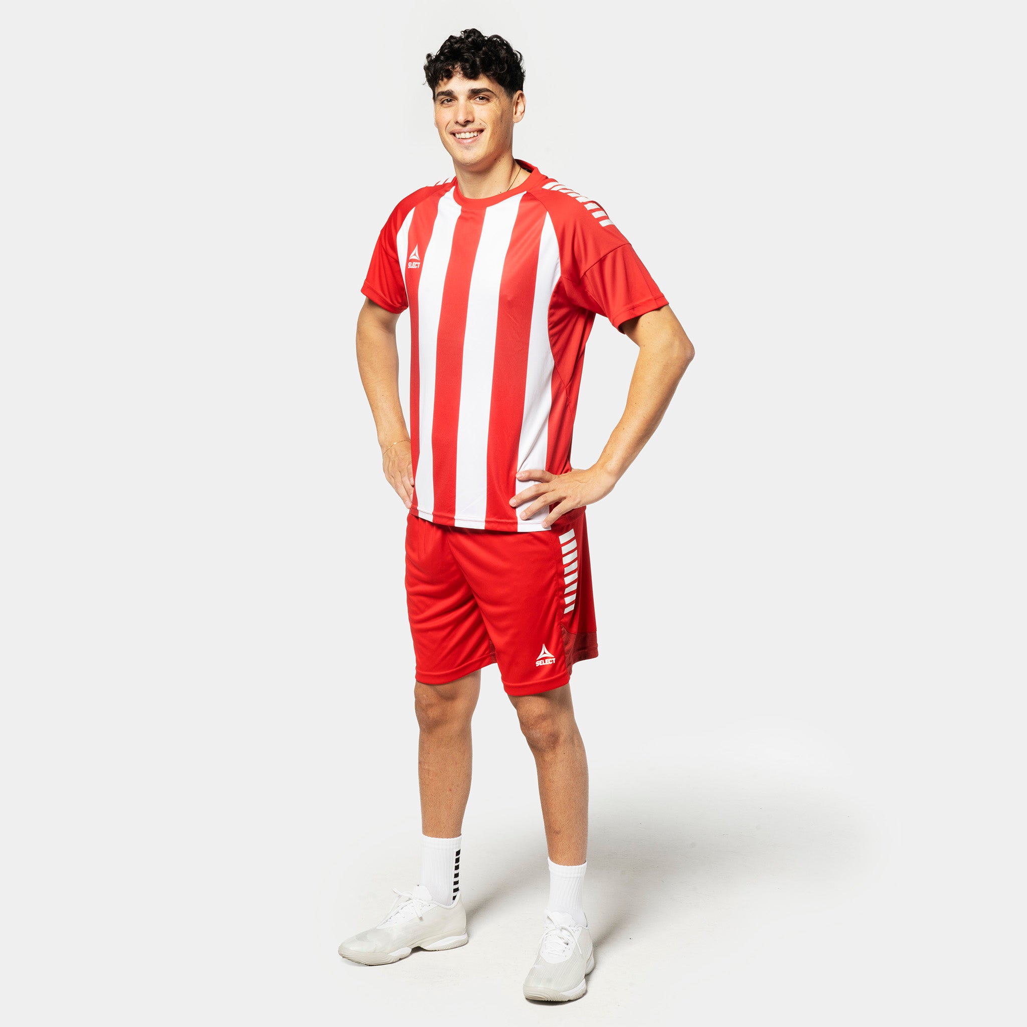 Man football player in red and white striped Player shirt S/S Spain striped v25 with red shorts, Match & Training wear.