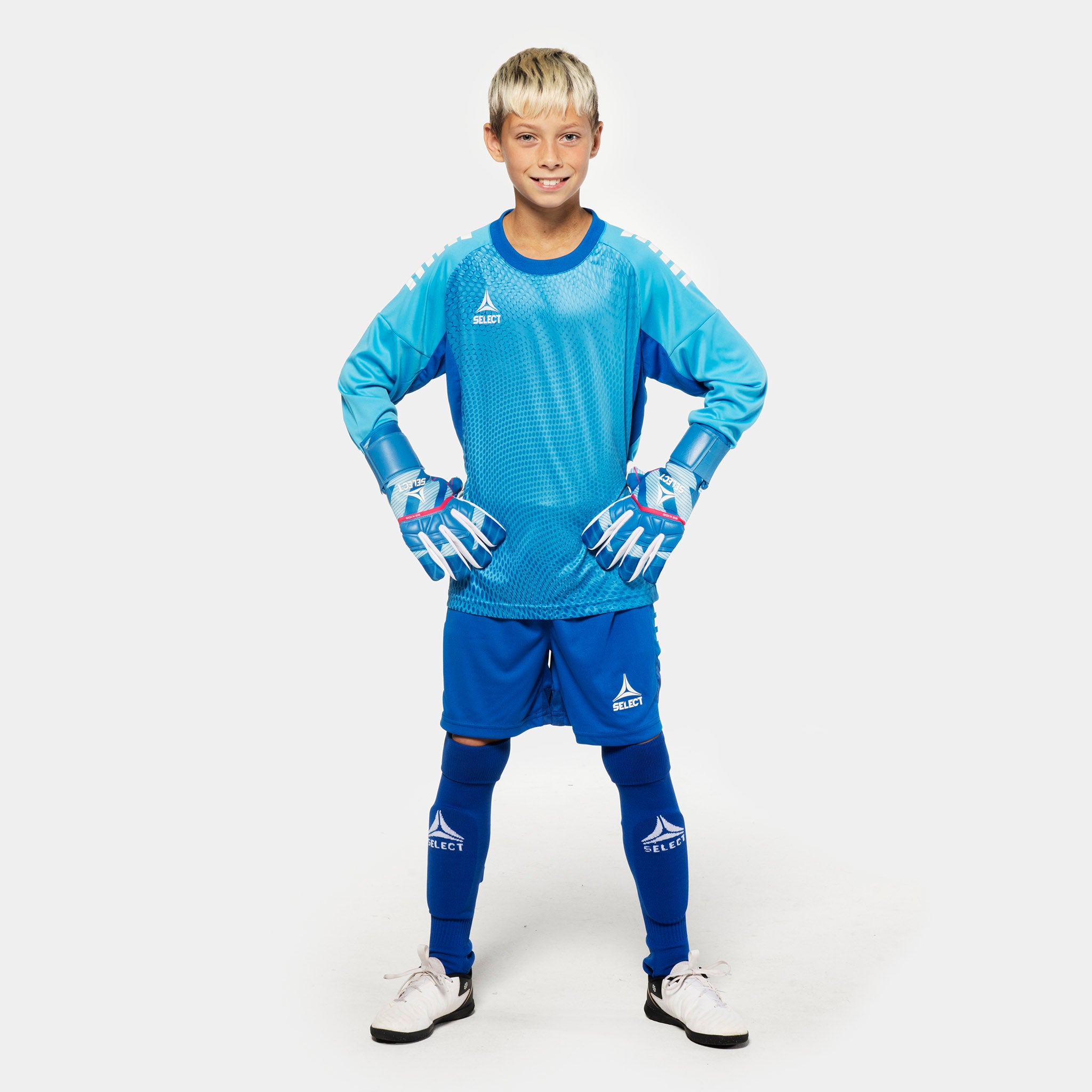 Boy football player in light blue Goalkeeper shirt Spain v25, blue shorts and gloves – Match & Training wear.