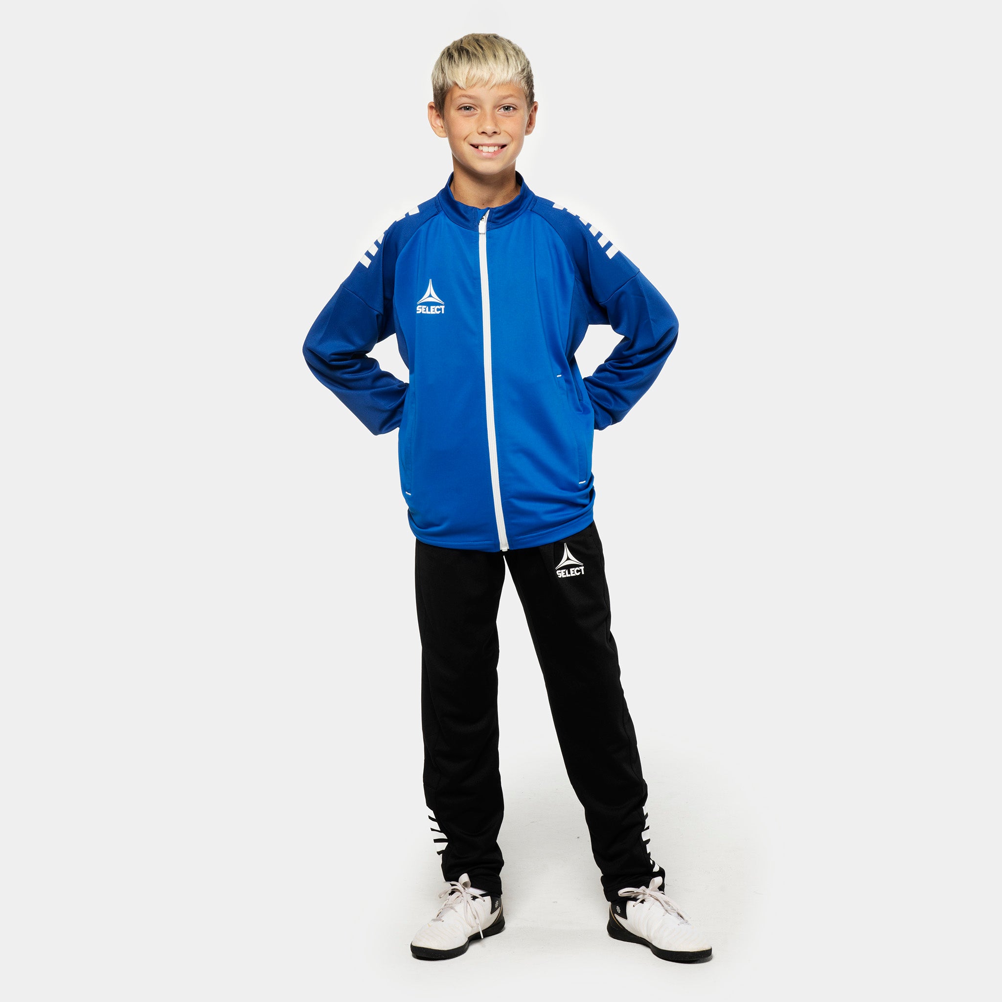 Boy football player in blue Training zip jacket & black Training pants regularFit Spain v25, Match & Training wear, front