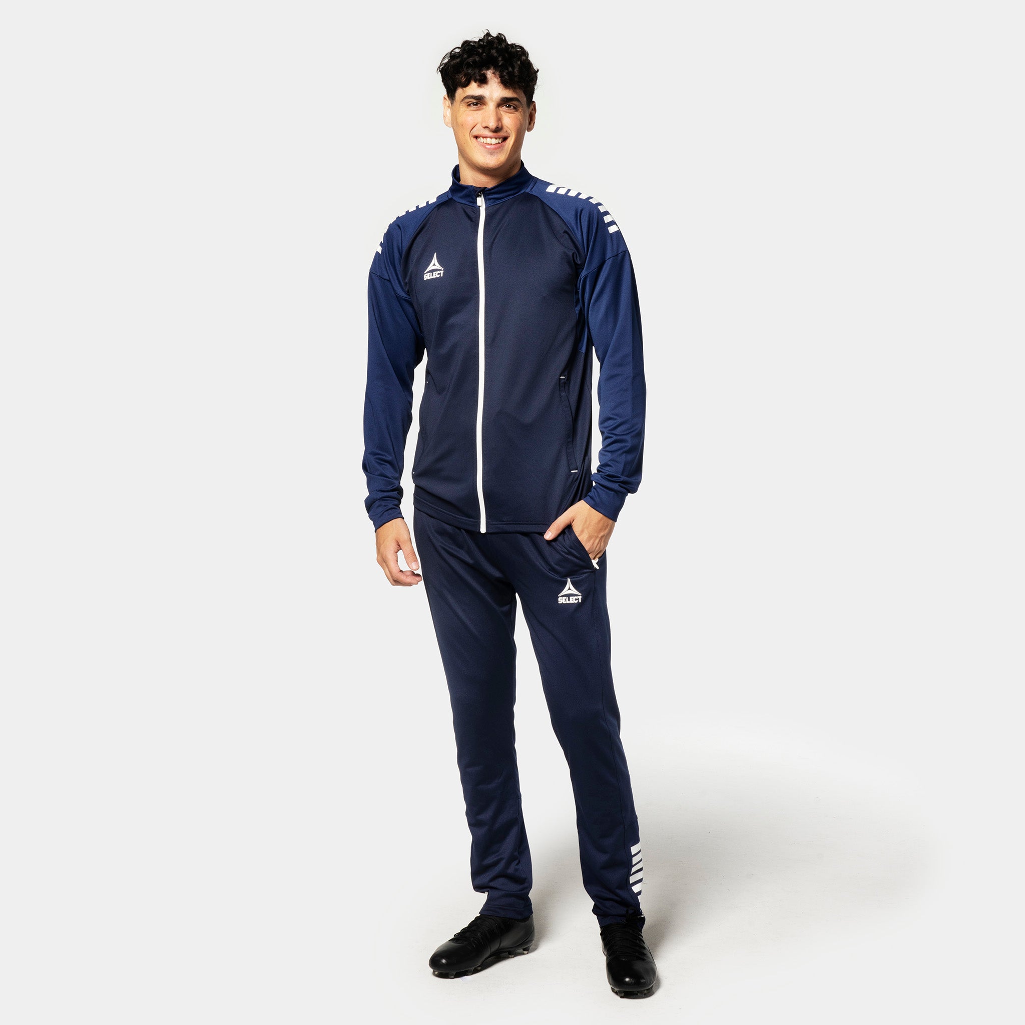 Man football player in navy and white Training zip jacket Spain v25, Match & Training wear, full front view.
