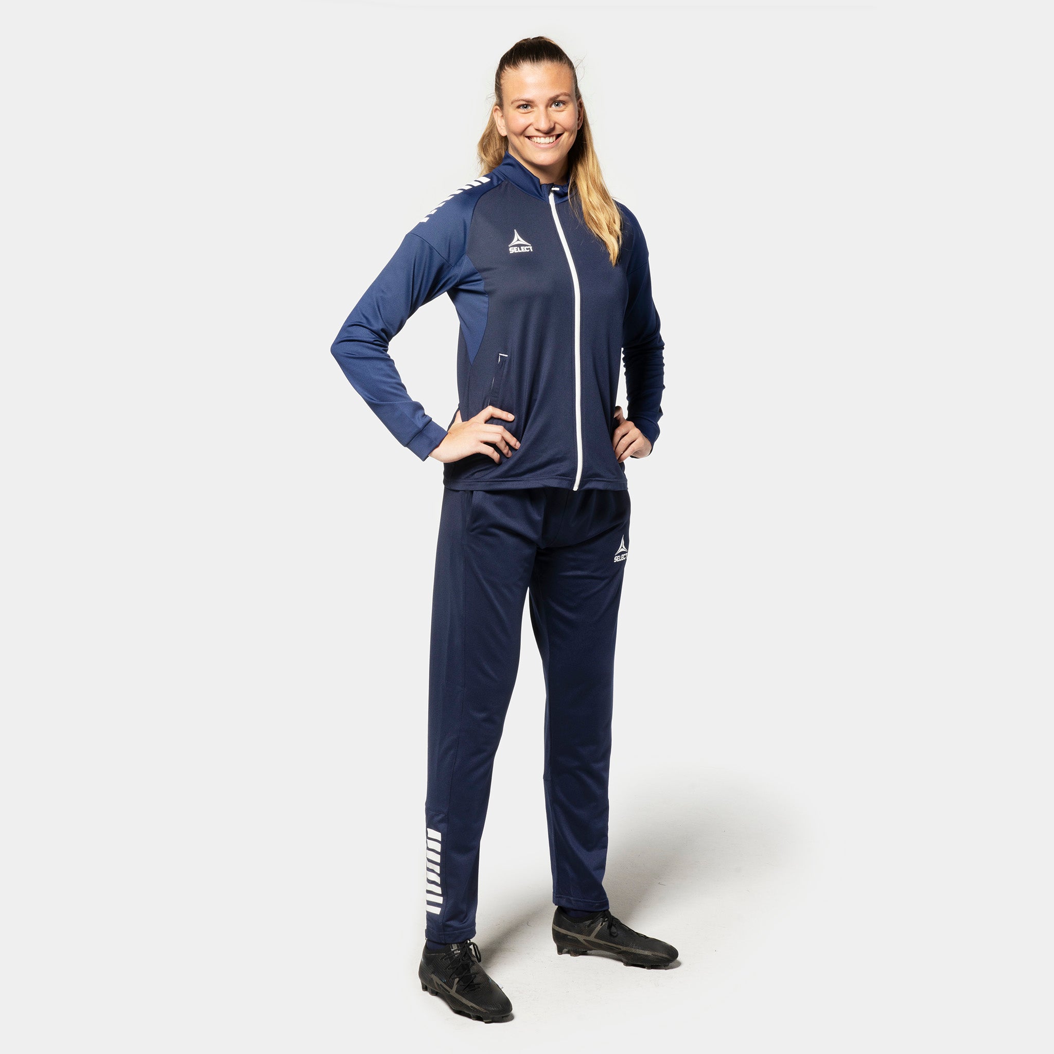 Woman football player in navy Training zip jacket Spain woman v25 and pants, Match & Training wear, front view
