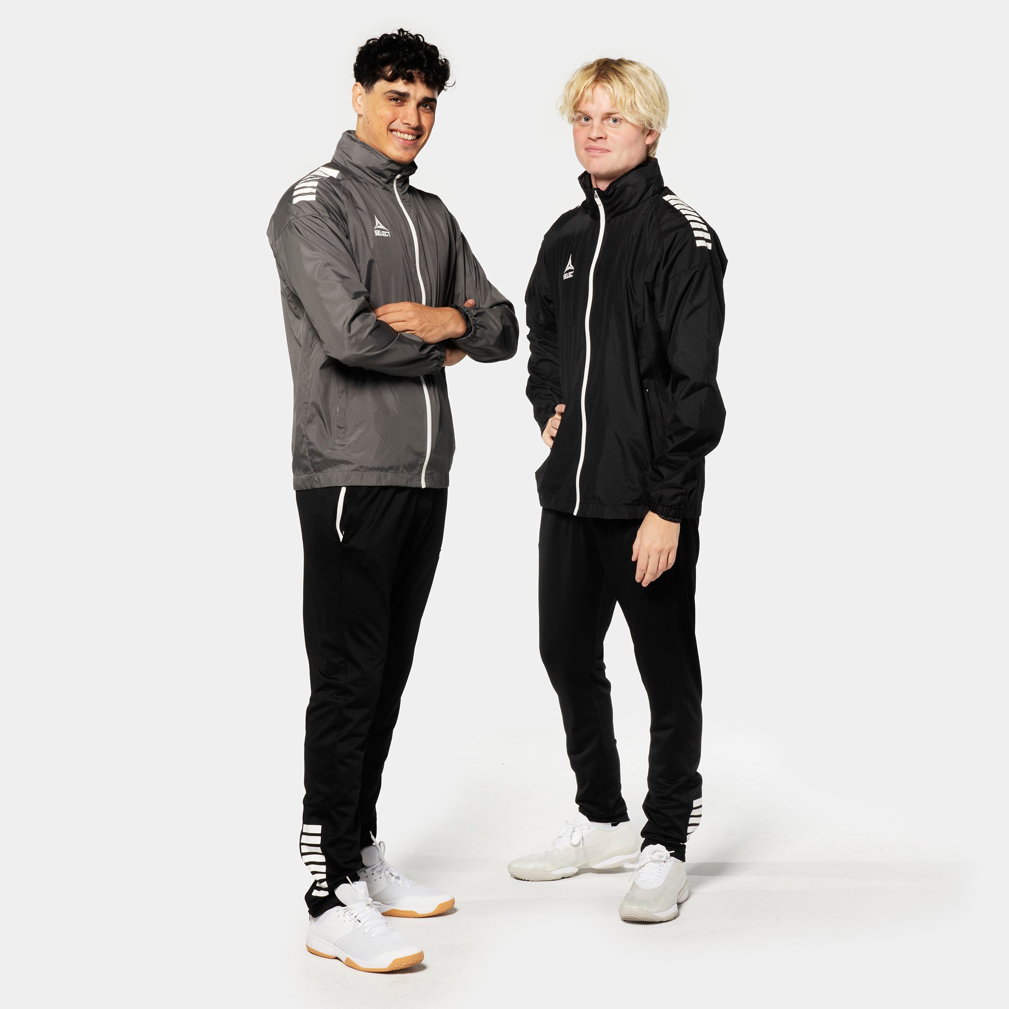 Two male football players in Training jacket Spain v25, grey-white and black-white, Match & Training wear, model front view